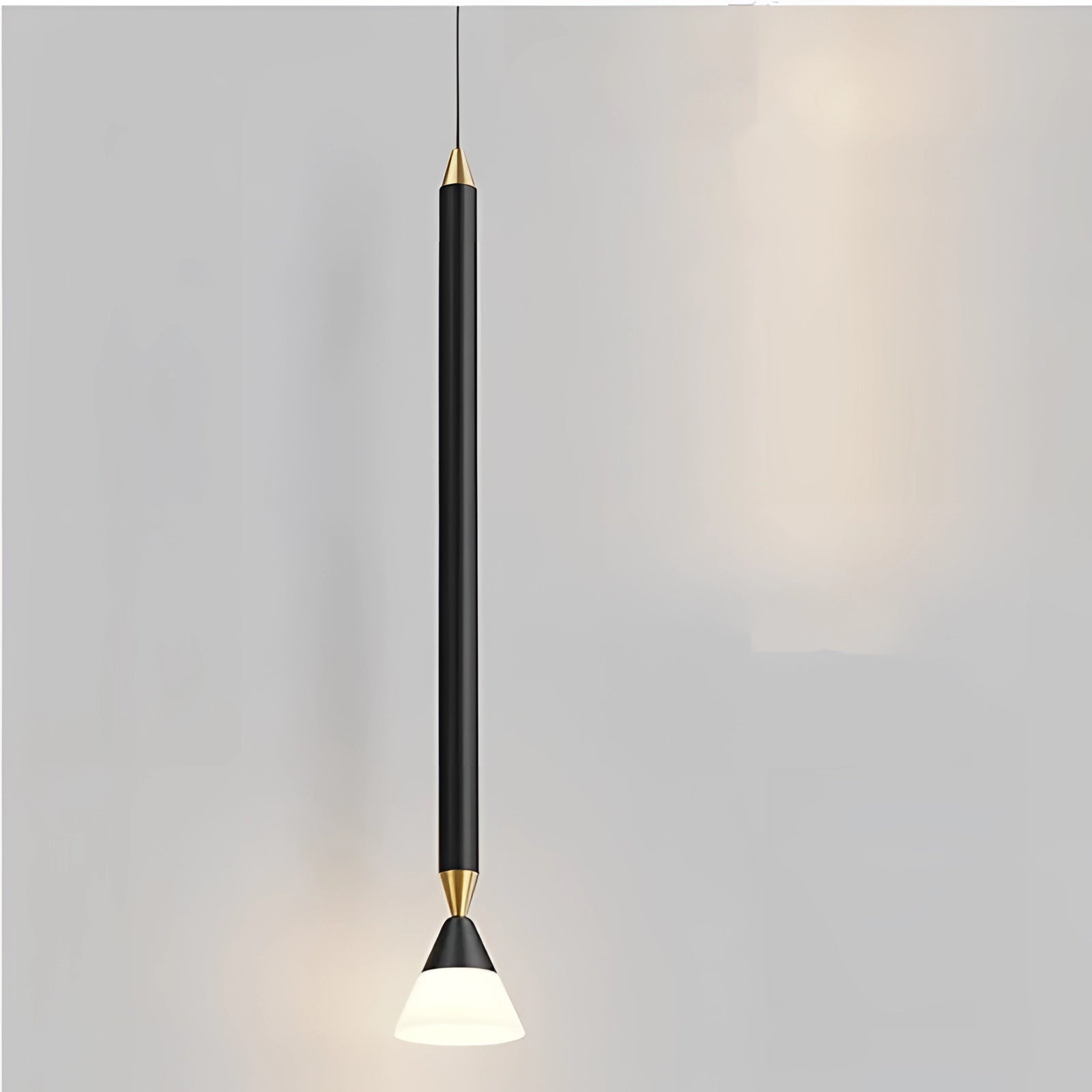 
A gold and black modern vertical pendant light elegantly hanging from the ceiling in a stylish interior setting, showcasing a sophisticated ceiling fixture with a 3 color change feature.