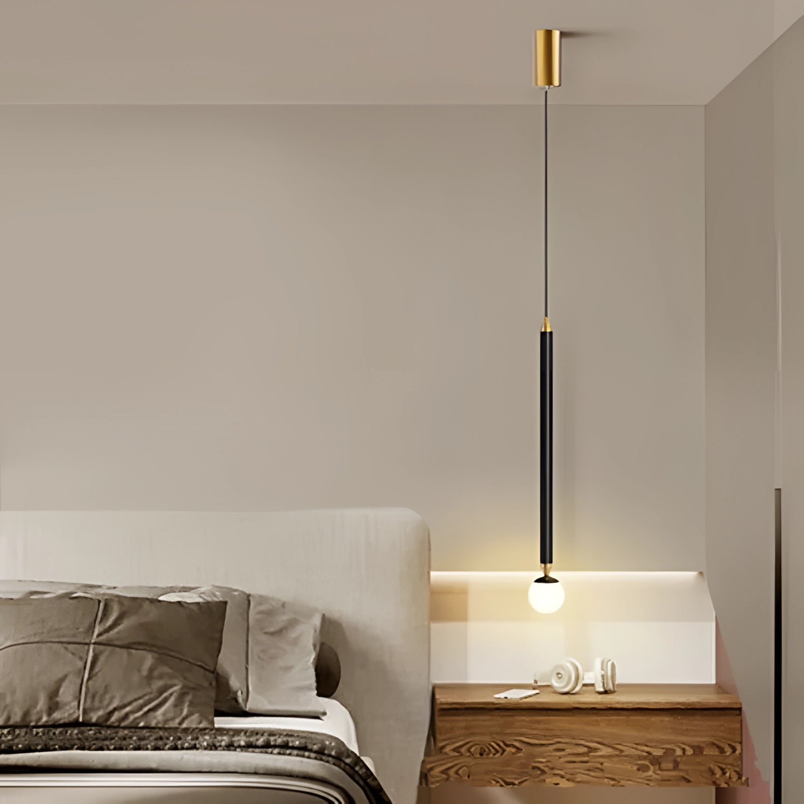 Modern gold and black vertical pendant light with a sleek rectangular design, featuring a three-color change function, suitable for elegant interior spaces.