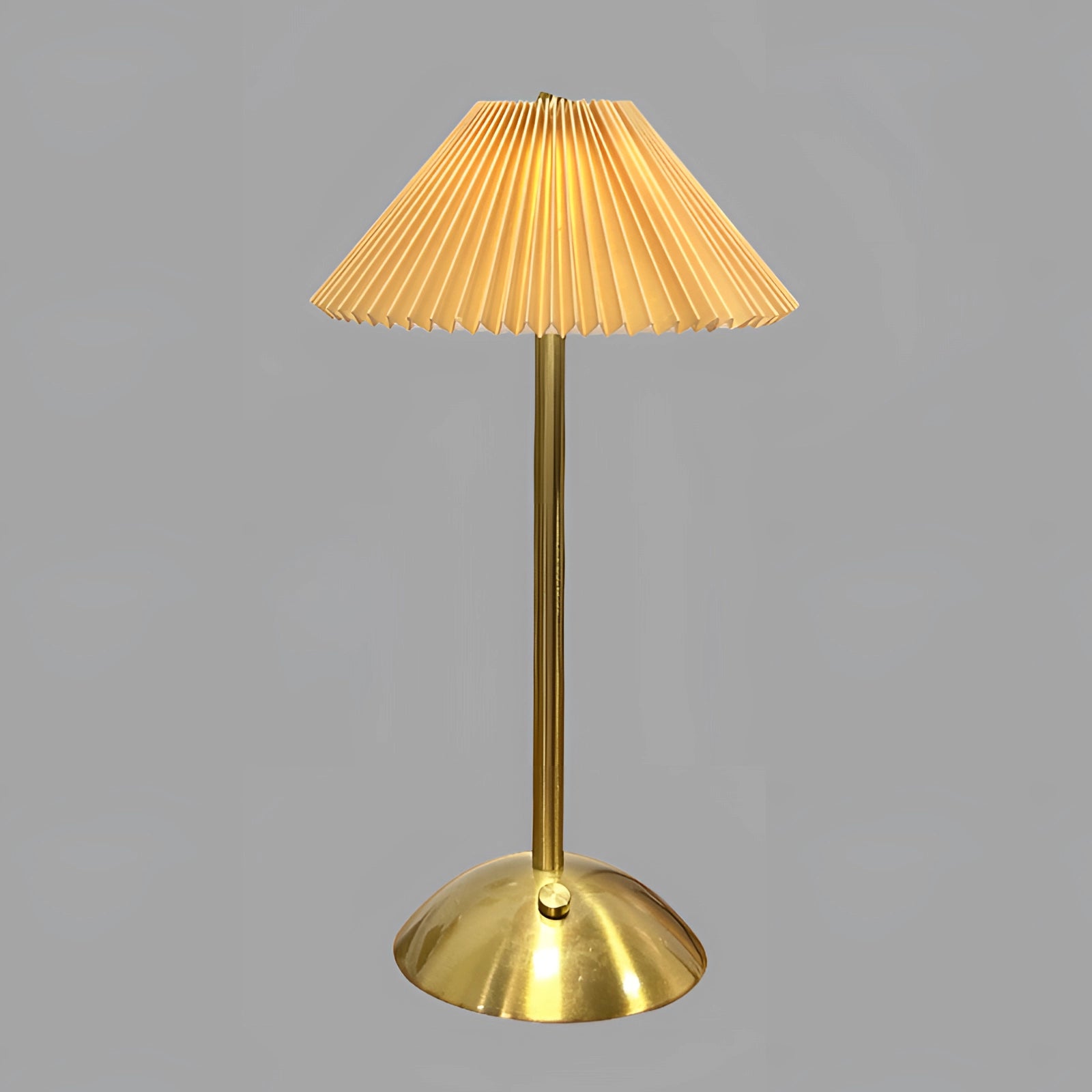 Vintage mid-century gold brass floor lamp with a pleated lampshade, featuring a retro design.