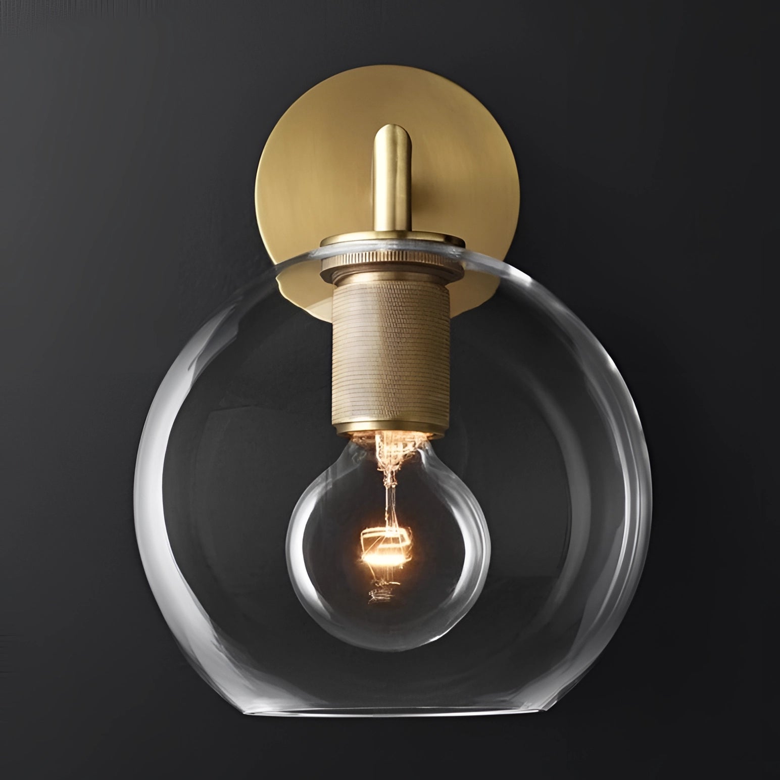 Gold brass wall sconce with a geometric glass design and vintage bulb, featuring an industrial minimal style.
