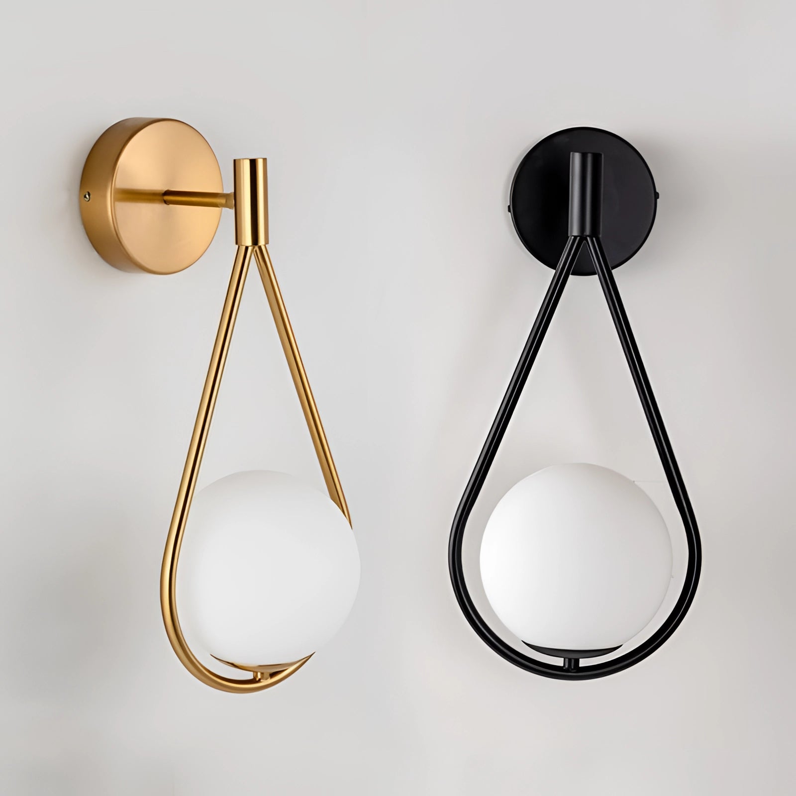 Gold Brass Wall Sconce featuring a modern geometric globe design, showcasing luxury lighting with a sleek metallic finish.