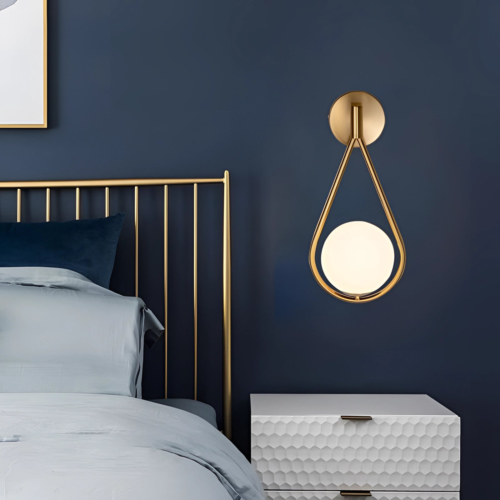 Gold Brass Wall Sconce with Modern Geometric Globe Lamp, mounted on a wooden wall, illuminating a cozy interior space.