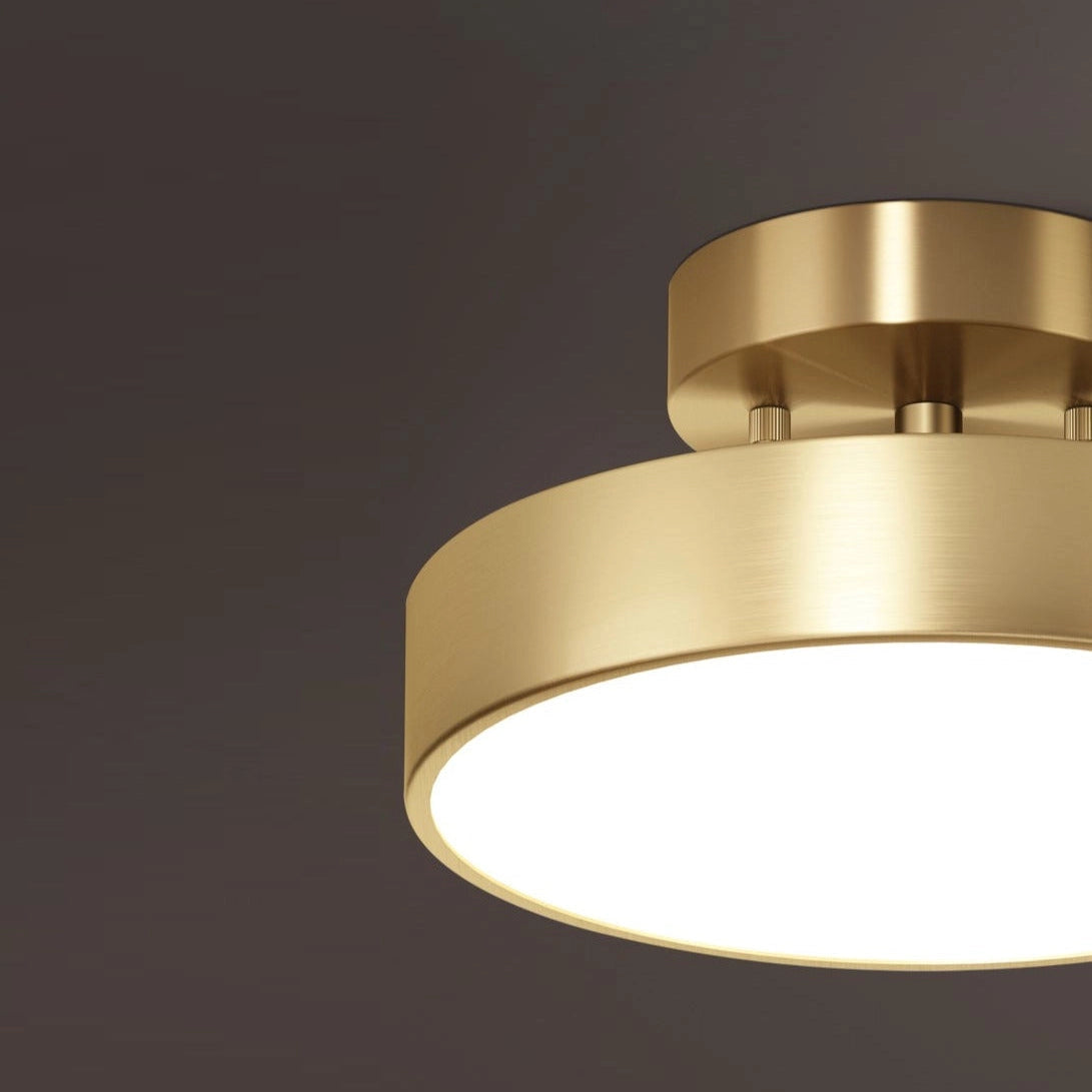 Modern minimalist circular gold LED flush mount ceiling light fixture.