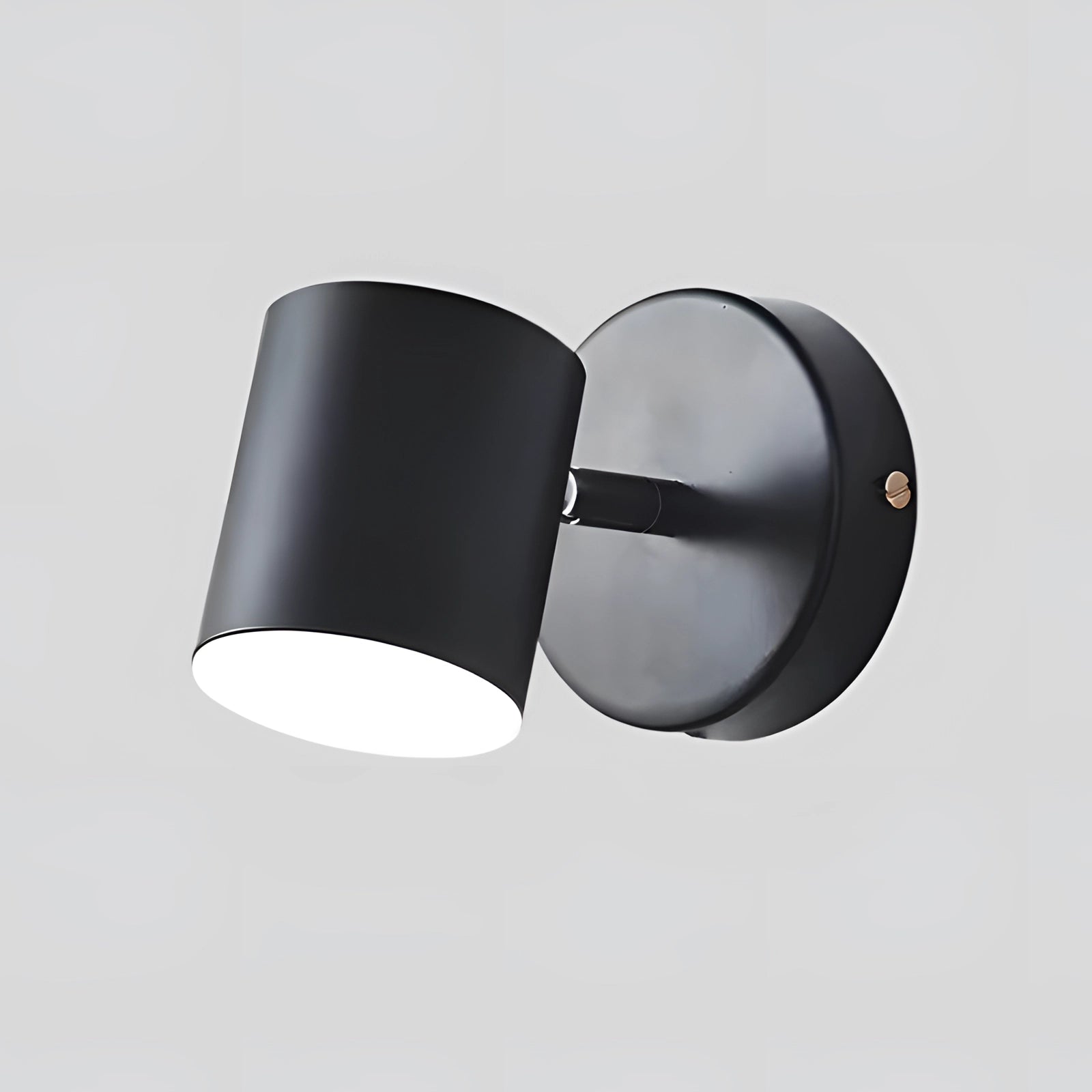 Gold LED wall lamp with a modern brass finish, featuring an adjustable spotlight design. The lamp has a sleek, cylindrical shape with a circular base, and is available in a black variant with a cold white light. Made from metal, it is designed for wall mounting, adding a contemporary touch to interior spaces.