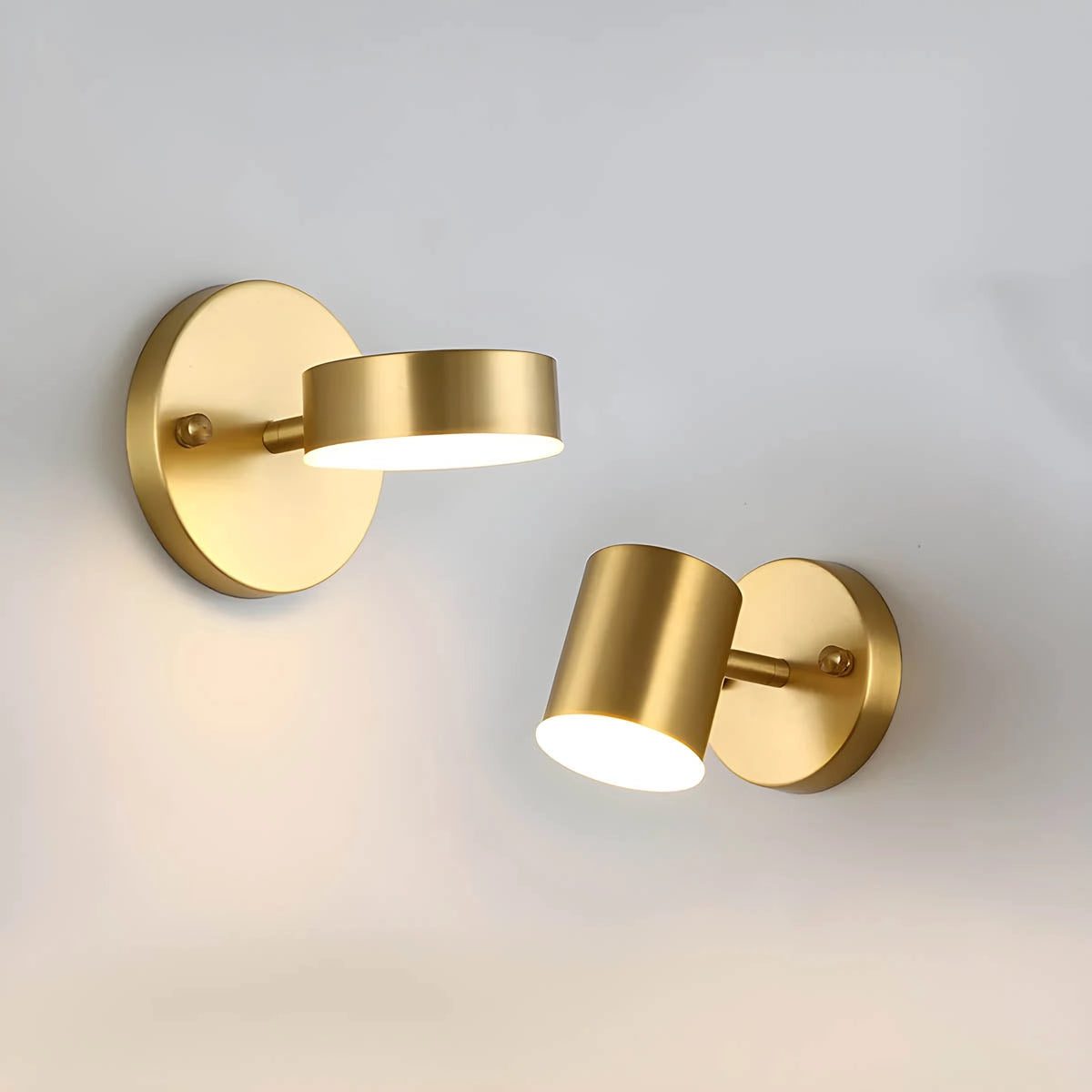 Gold LED wall lamp with modern brass finish, featuring an adjustable spotlight design mounted on a wooden wall background. The lamp has a sleek, cylindrical shape, blending art and functionality with its metallic elements.