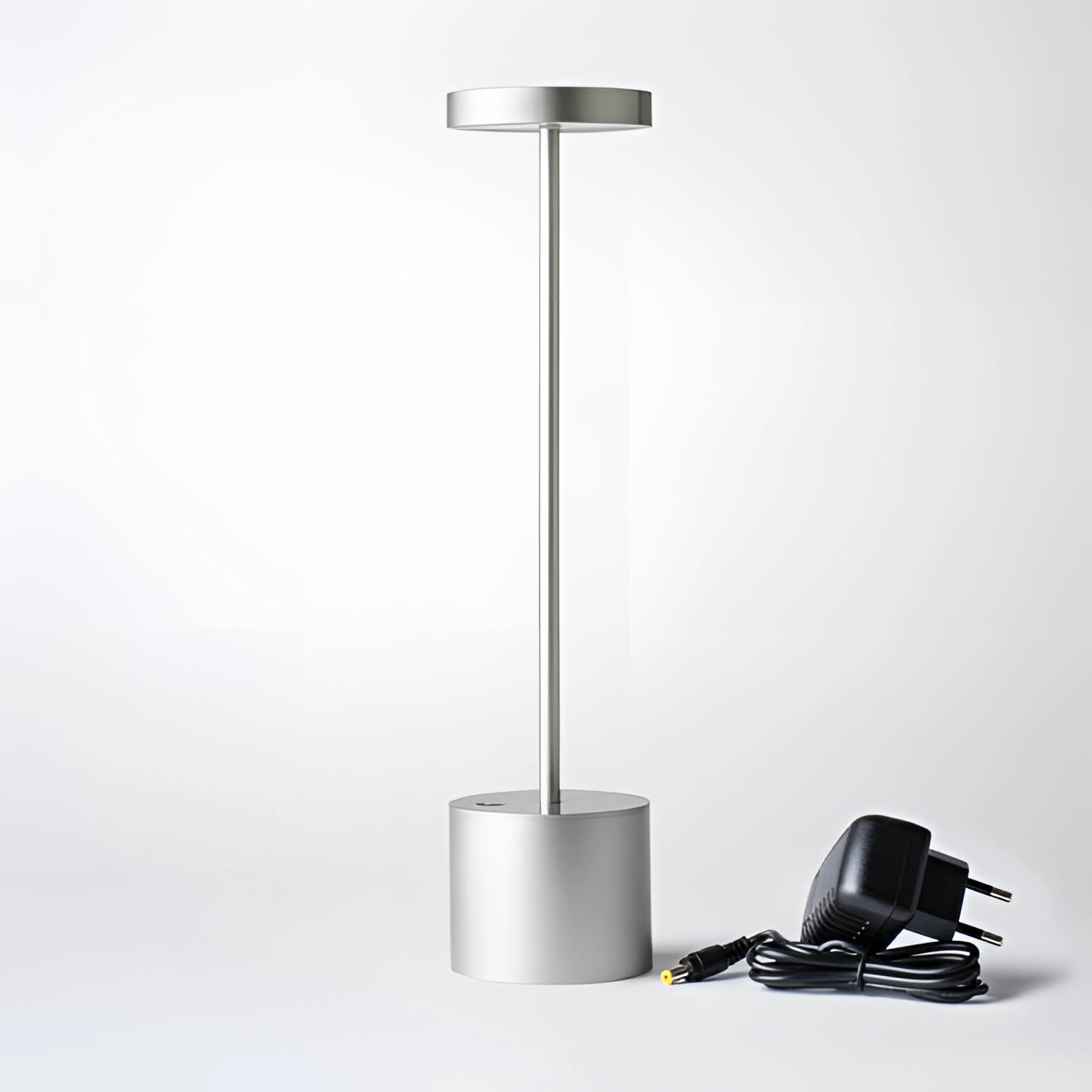 Gold Minimalistic LED Desk Lamp with Circular Head and Brass Finish on a modern desk.