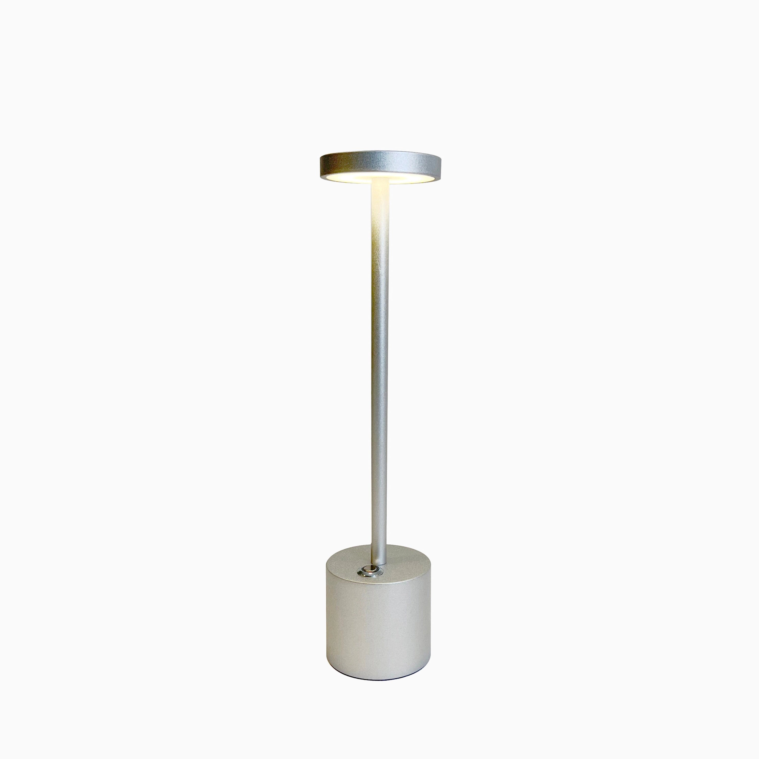 Gold Minimalistic LED Desk Lamp with Circular Head and Brass Finish on a stylish desk.