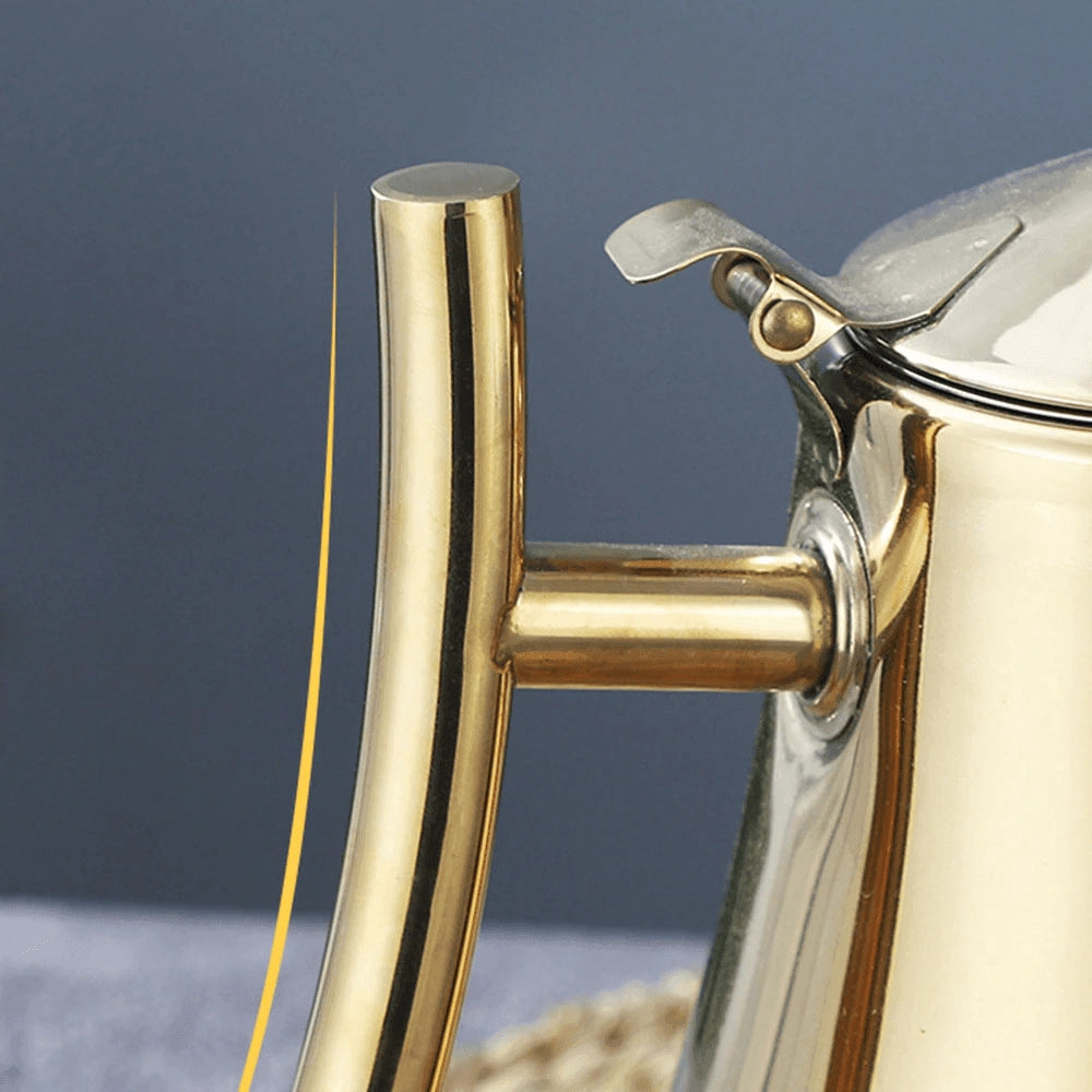Elegant gold stainless steel teapot with a sleek, modern design, featuring a polished finish and luxurious aesthetic.