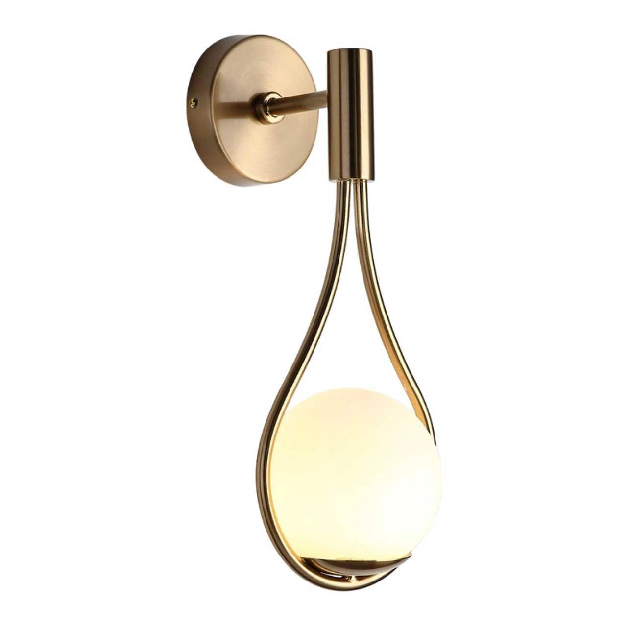 Sophisticated gold wall-mounted soap dispenser designed for modern bathrooms, showcasing a sleek metal and glass construction in a circular form, positioned against a wooden backdrop.