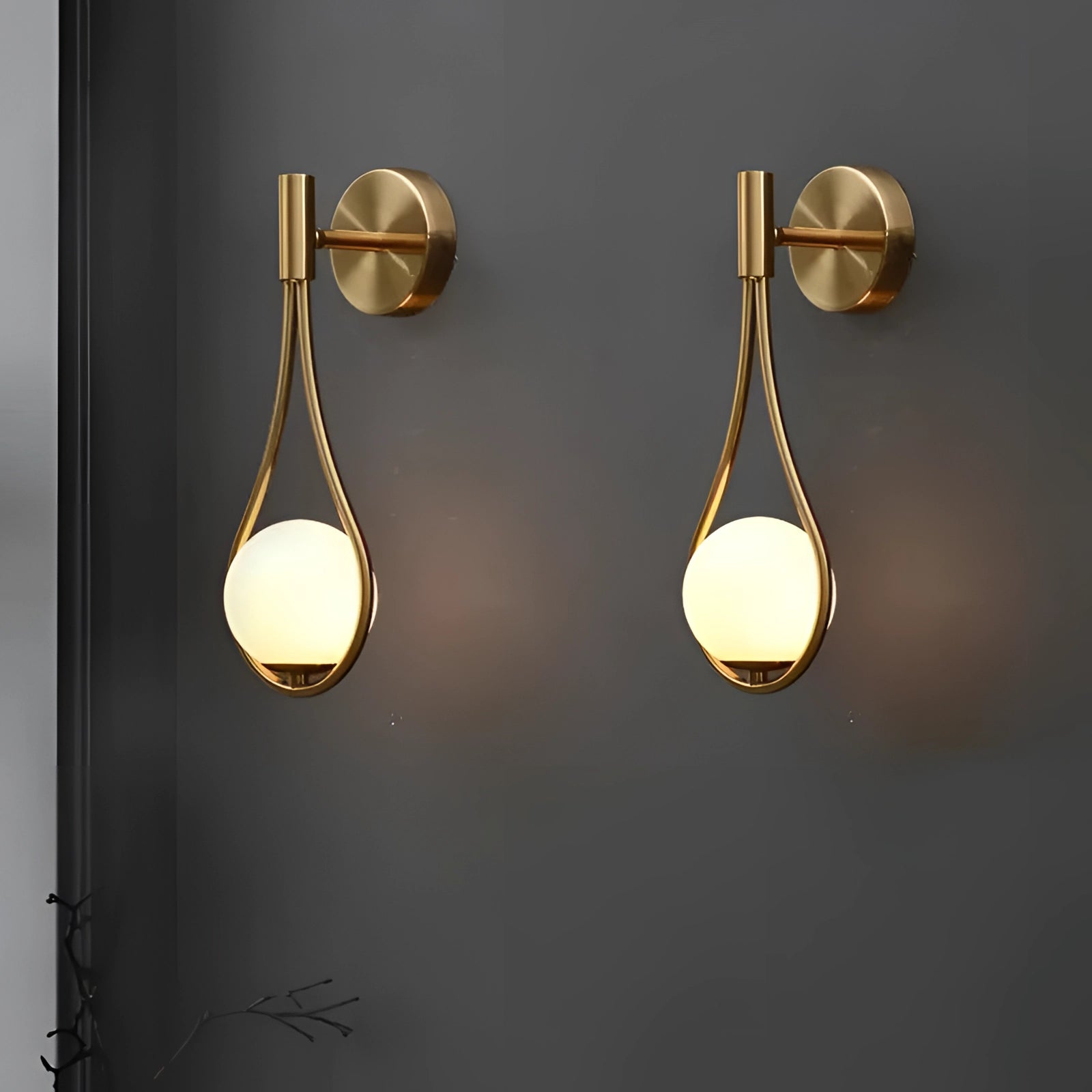 
A gold wall-mounted luxury soap dispenser with a modern design, featuring a sleek and elegant appearance, ideal for upscale bathroom settings.