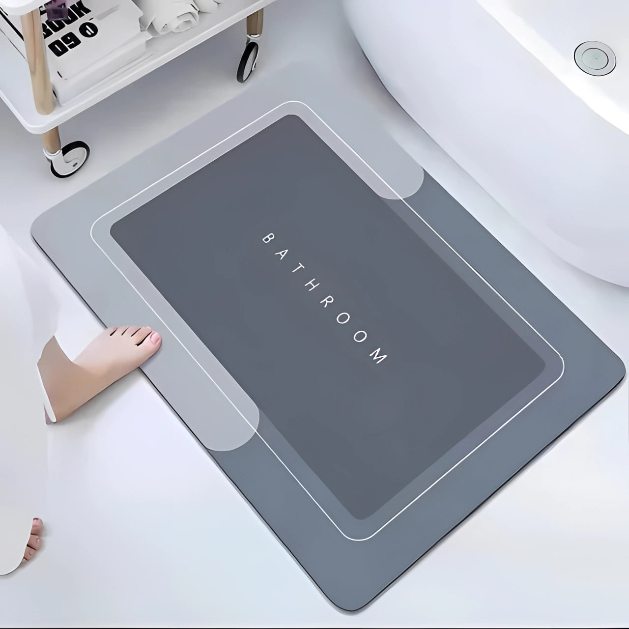 Gray non-slip memory foam bath mat with a quick-drying feature, displayed on a bathroom floor.