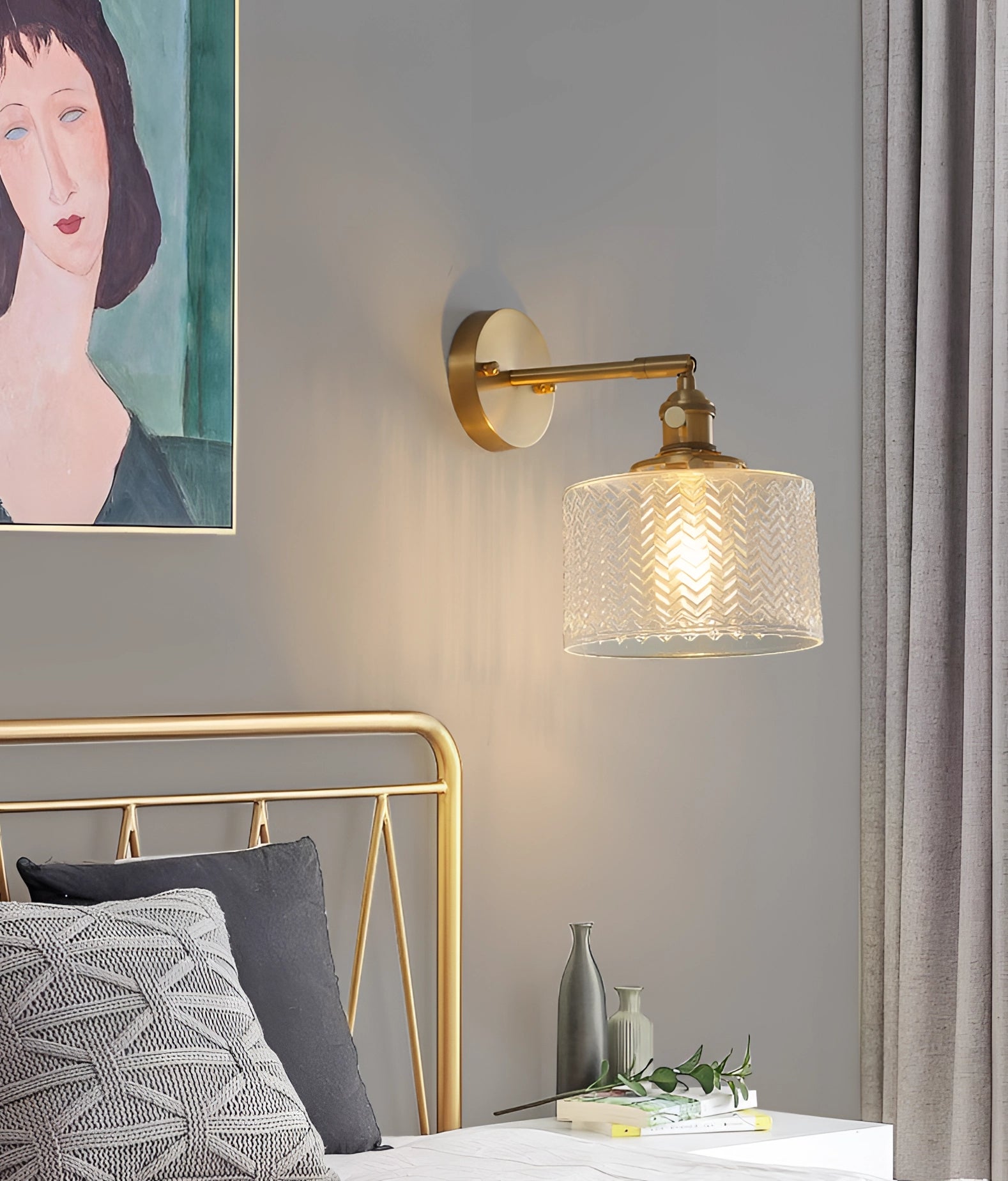 A stylish green chevron wall lamp with a geometric pattern, featuring a brass sconce and rectangular shape, mounted on a wooden wall, adding a warm yellow glow to the interior design of a house.