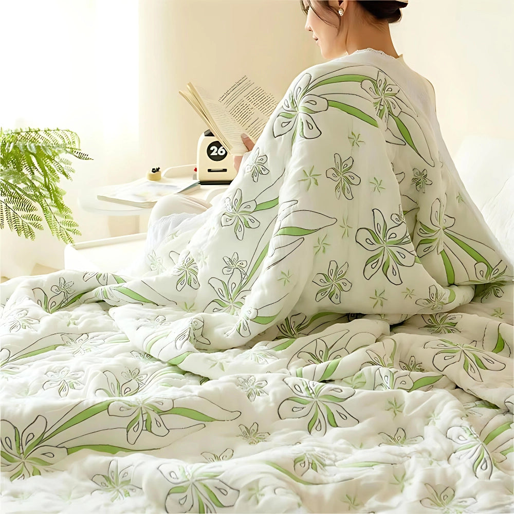 Green floral luxury bedding set featuring a designer duvet cover decorated with an elegant botanical pattern, showcasing textiles that evoke comfort and style.