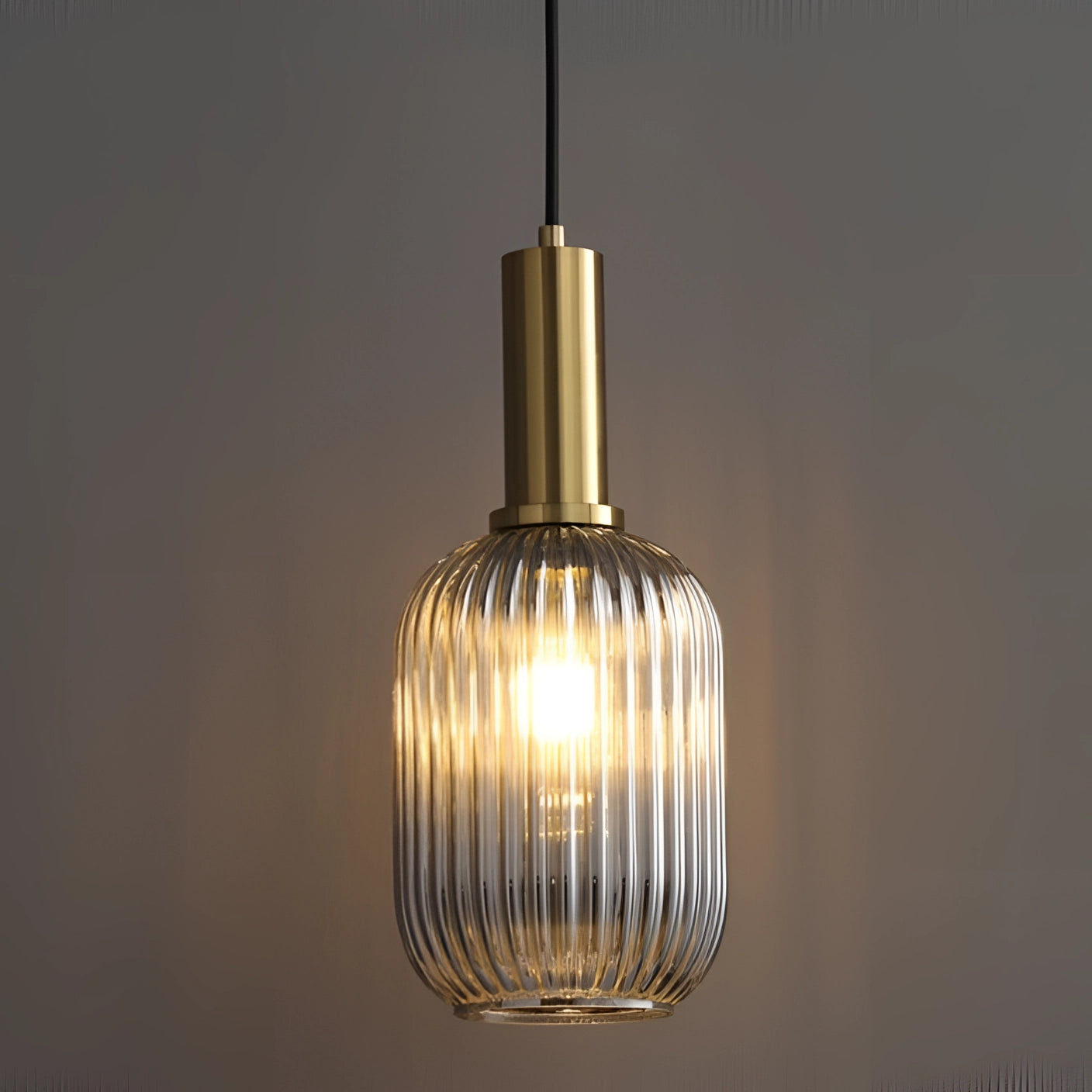 Green Ribbed Glass Pendant Light with Gold Accent, modern Scandinavian decor, hanging and illuminated, showcasing intricate ribbed glass texture and elegant gold detailing.