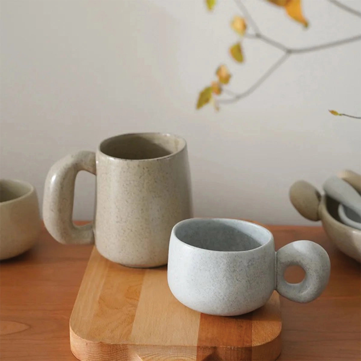 Handcrafted speckled ceramic mug showcasing an eco-friendly, artisan design, perfect for serving coffee or tea.