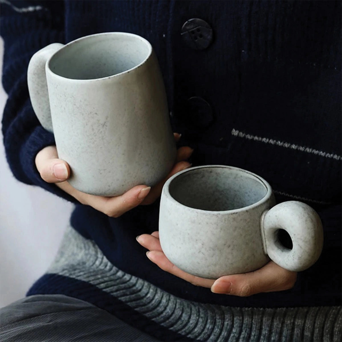 Handcrafted speckled ceramic mug in gray, size L, showcasing eco-friendly artisan craftsmanship, suitable for coffee or other beverages.