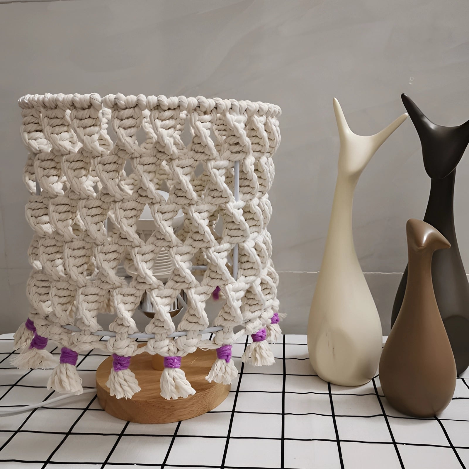 Handmade Boho Macrame Lampshade with intricate tassel design, featuring a unique and artistic pattern, in a soft white color, made from natural materials, showcasing its bohemian aesthetic.