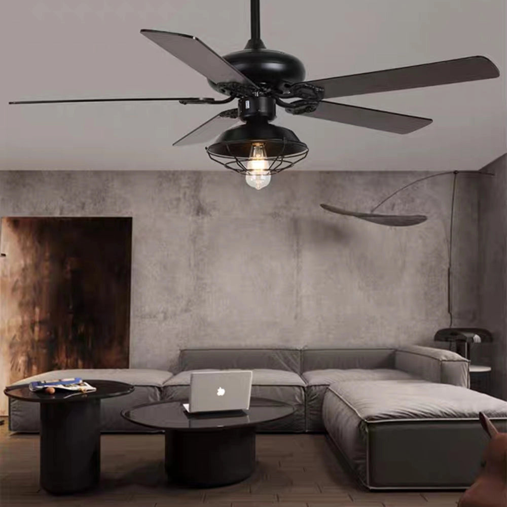 Industrial black ceiling fan with integrated light and remote control, featuring a vintage outdoor design, installed in a modern interior setting.