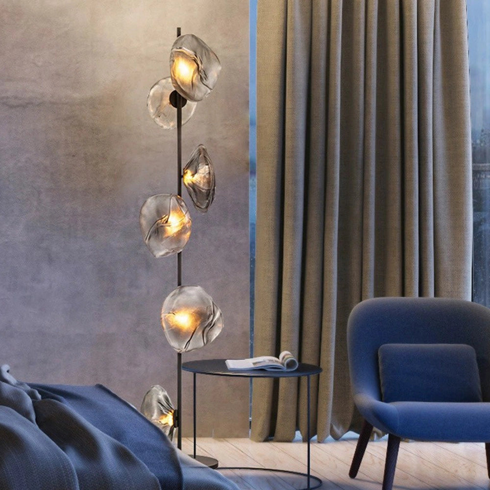 Industrial metallic pebble floor lamp with six heads in black and smoke gray finish, featuring a sculptural design suitable for modern interior decor.