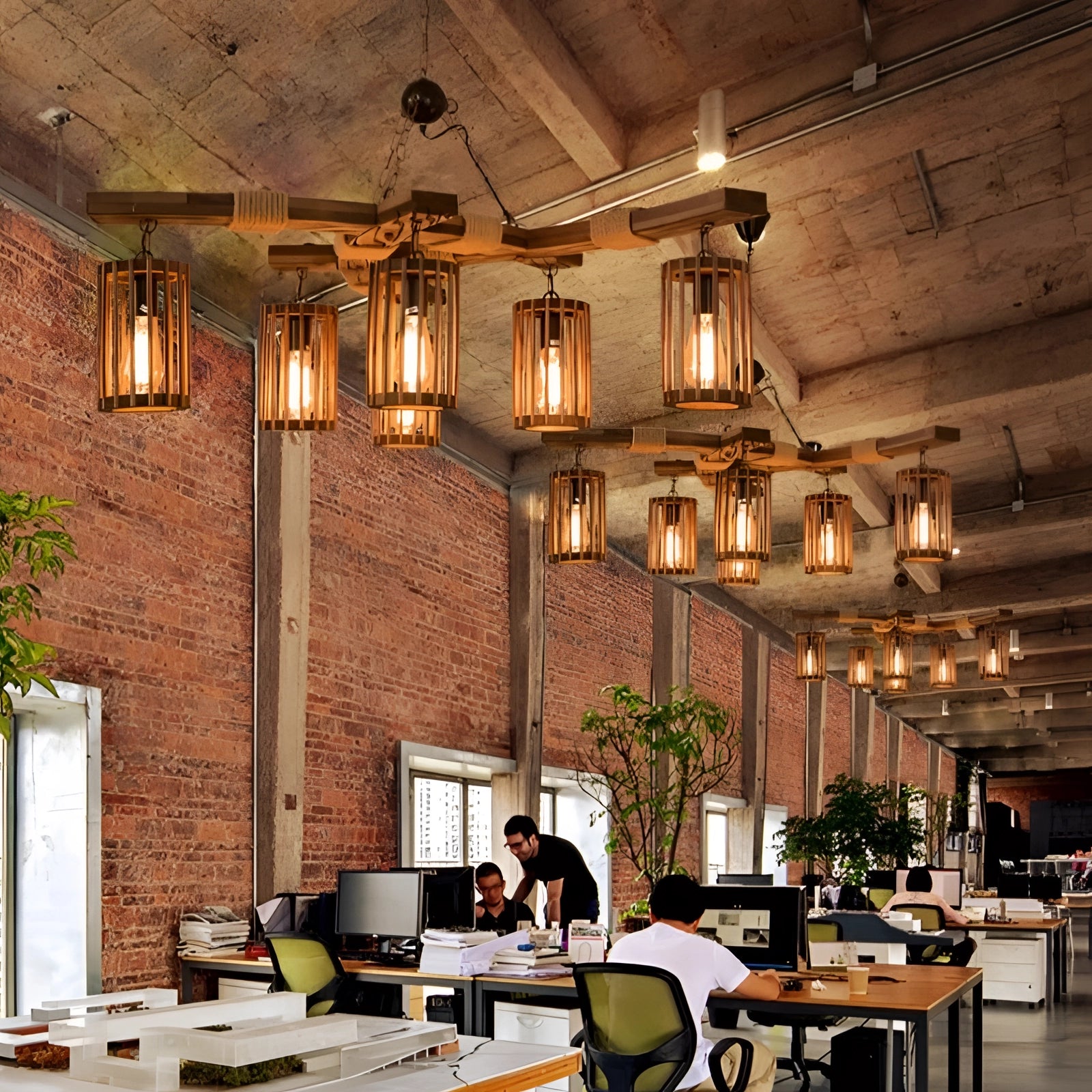 Industrial vintage cage pendant light with rustic wood beam chandelier featuring six lights, hanging in a modern interior setting with furniture and houseplants.