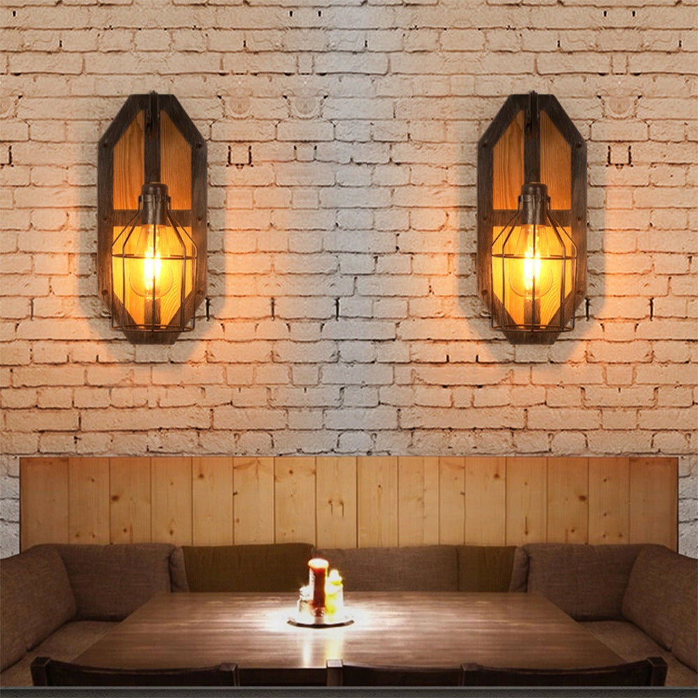 Industrial vintage pulley wall lamp featuring a 15.7-inch rustic wood and metal sconce, with an amber glow illuminating an interior space.
