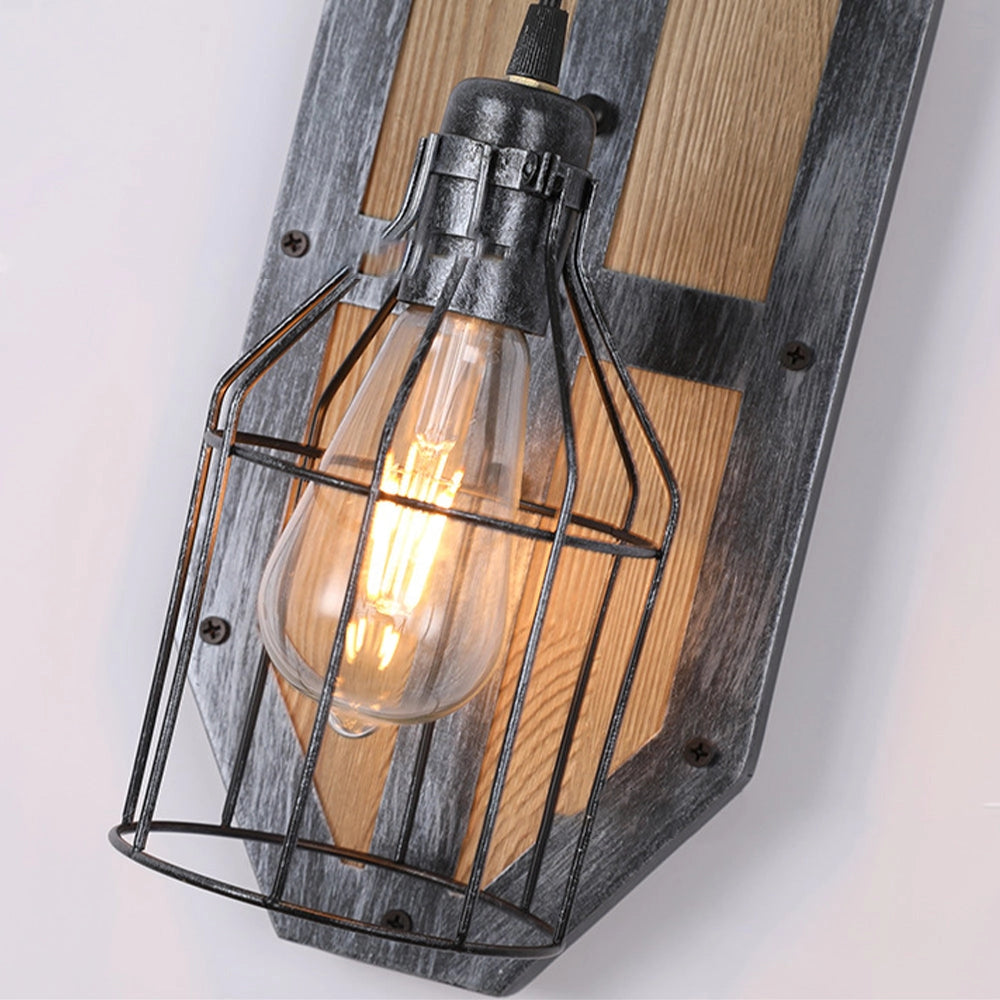 Industrial vintage pulley wall lamp featuring a rustic wooden and metal sconce design with an amber light bulb encased in glass, blending classic lantern aesthetics with modern functionality.