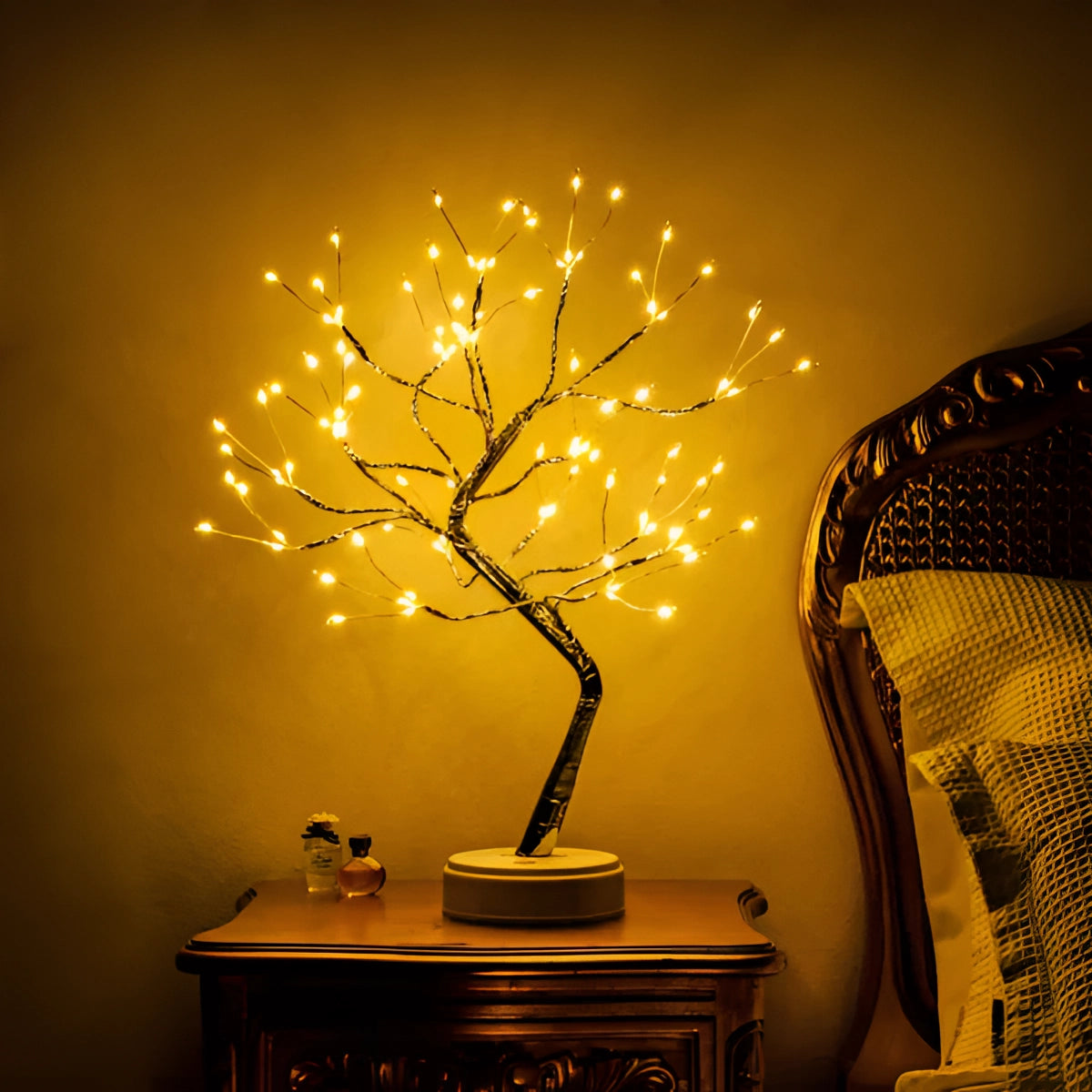 LED Bonsai Tree Light featuring three interconnected bonsai trees with warm white LEDs on a tabletop, creating an ambient, nature-inspired display with a soft amber glow, suitable for interior decoration.