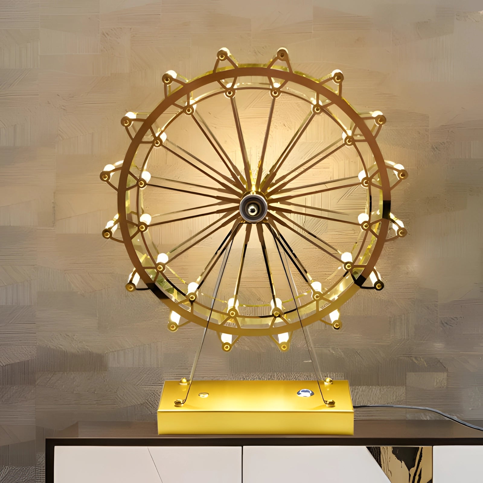 LED gold Ferris wheel table lamp with amber-colored lighting, featuring a circular and symmetrical design made of metal.
