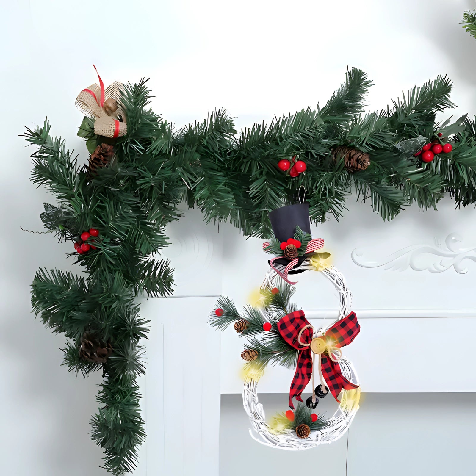 Rustic LED snowman wreath decorated with Christmas ornaments and evergreen twigs, perfect for holiday decor, battery-operated for convenience.