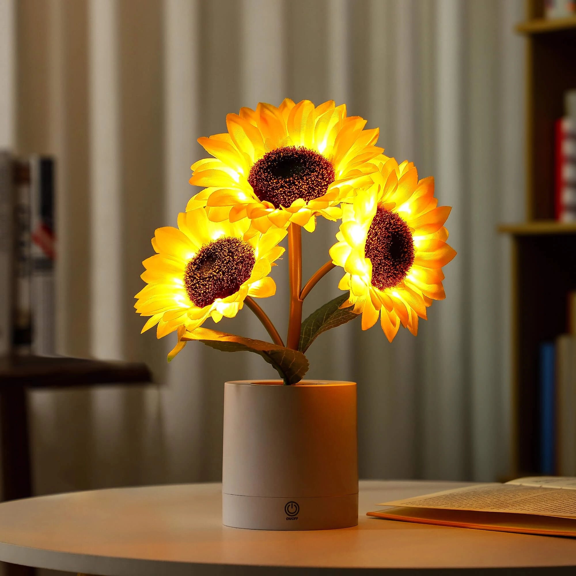 LED sunflower lamp on a wooden table, featuring orange artificial petals arranged in a vase, designed for home decor and USB charging.