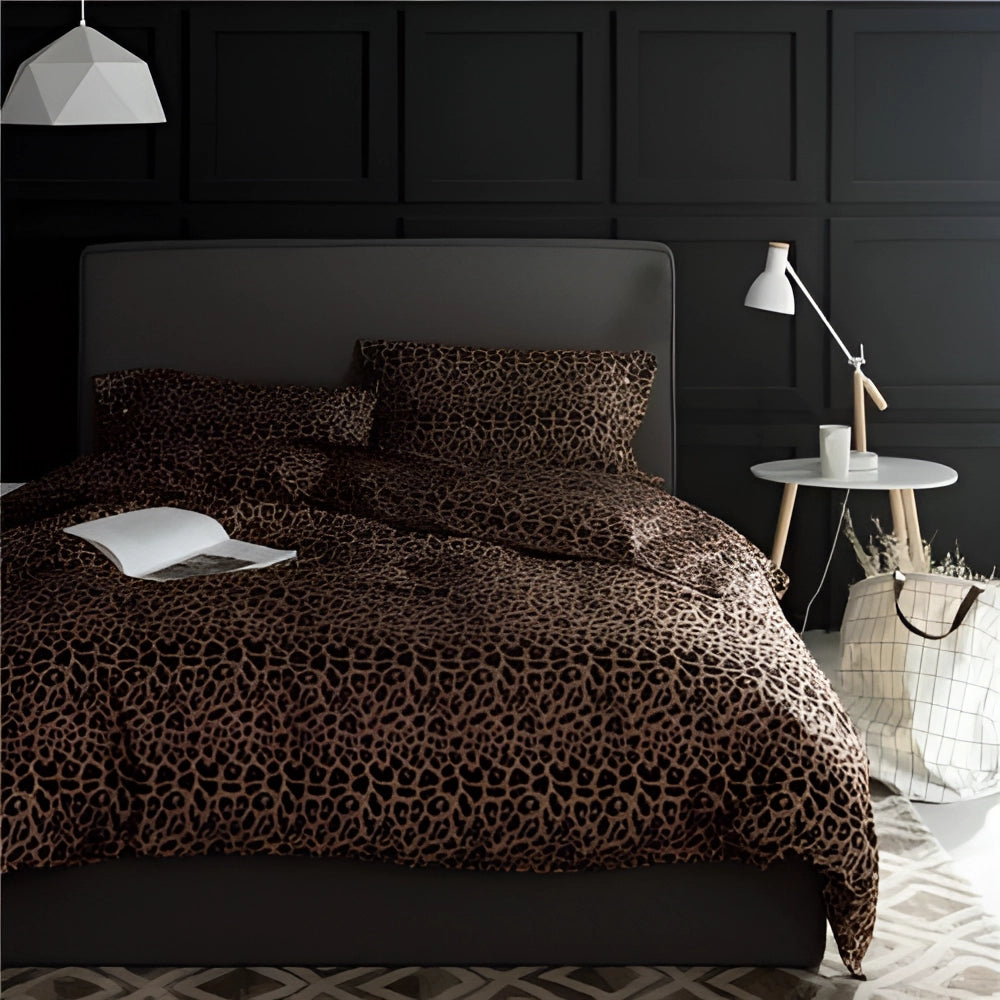 Leopard print Egyptian cotton queen duvet and sheets set neatly arranged on a bed with a wooden frame, featuring pillows, surrounded by modern interior design elements and soft lighting.