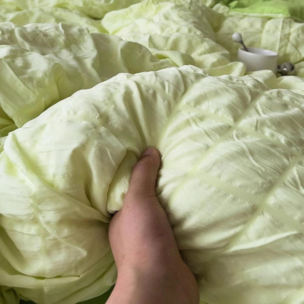 Light blue ruffled comforter set with a plush textured design shown in green, sized 200x230cm, displayed with two matching pillowcases on a neatly made bed.