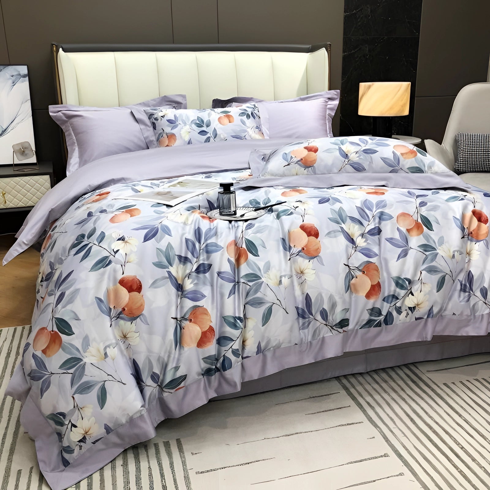 Luxurious lilac floral bedding set made from Egyptian cotton, neatly arranged on a bed with a grey bed frame, surrounded by stylish interior design elements and a light-colored floor and wall.