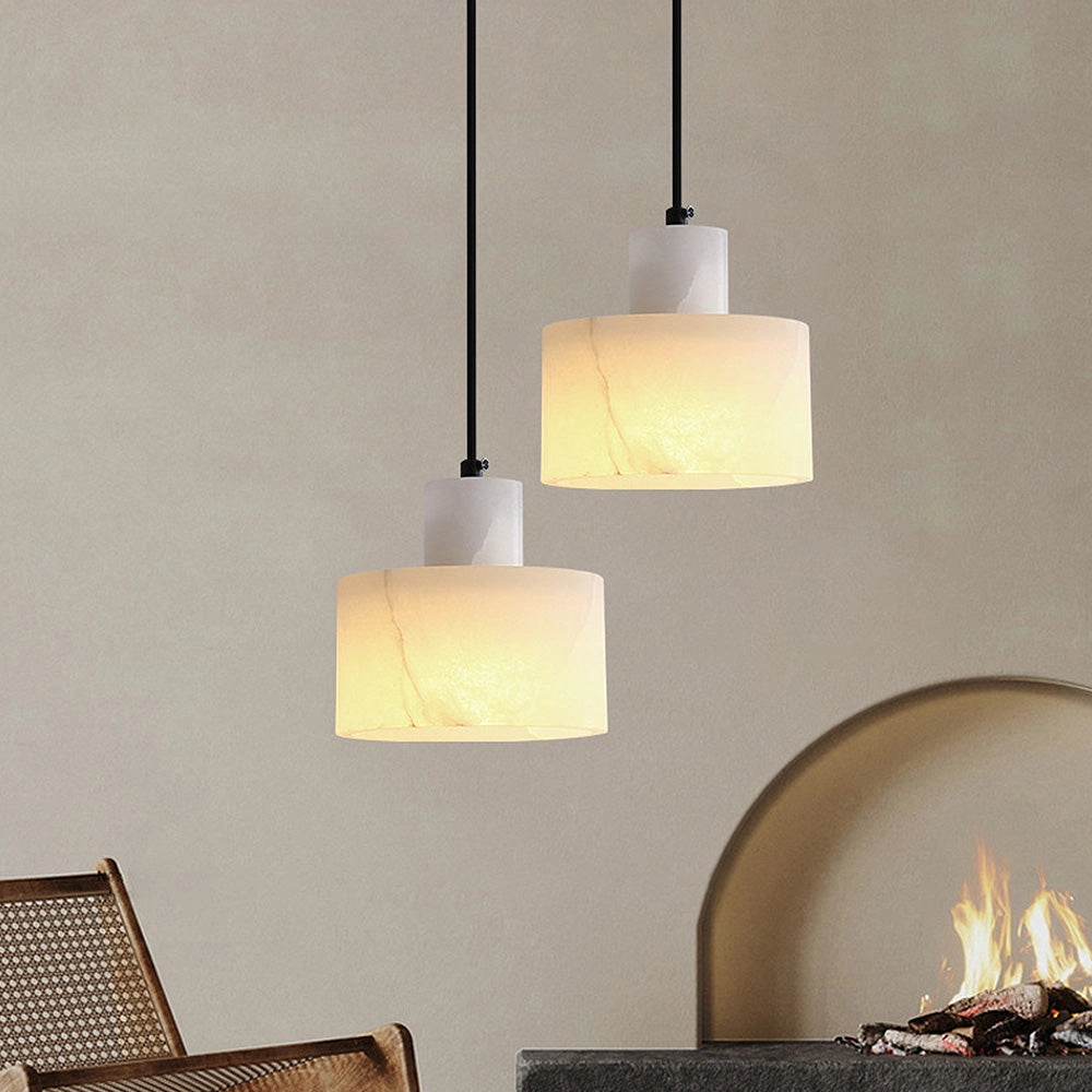 Luxury Alabaster Pendant Light in natural stone, hanging from a ceiling with minimalist design elements, providing elegant illumination to the interior space.