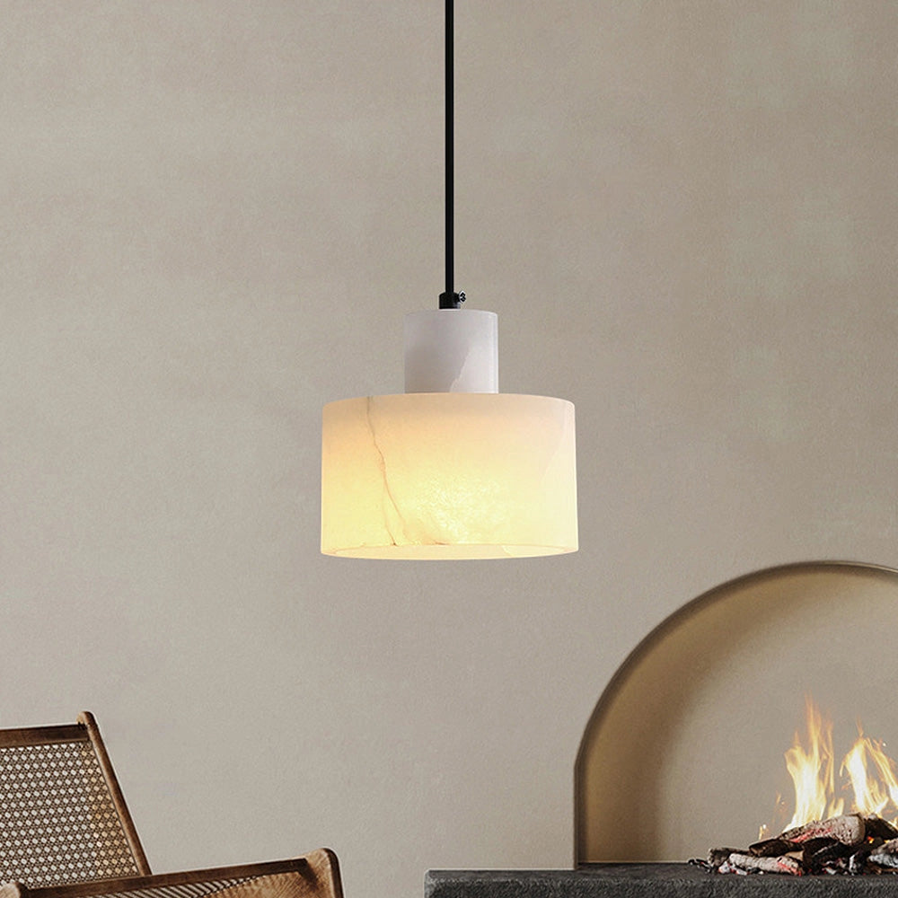 Luxury Alabaster Pendant Light made from natural stone, featuring a minimalist design, hanging from the ceiling, with a warm glow illuminating the surroundings.