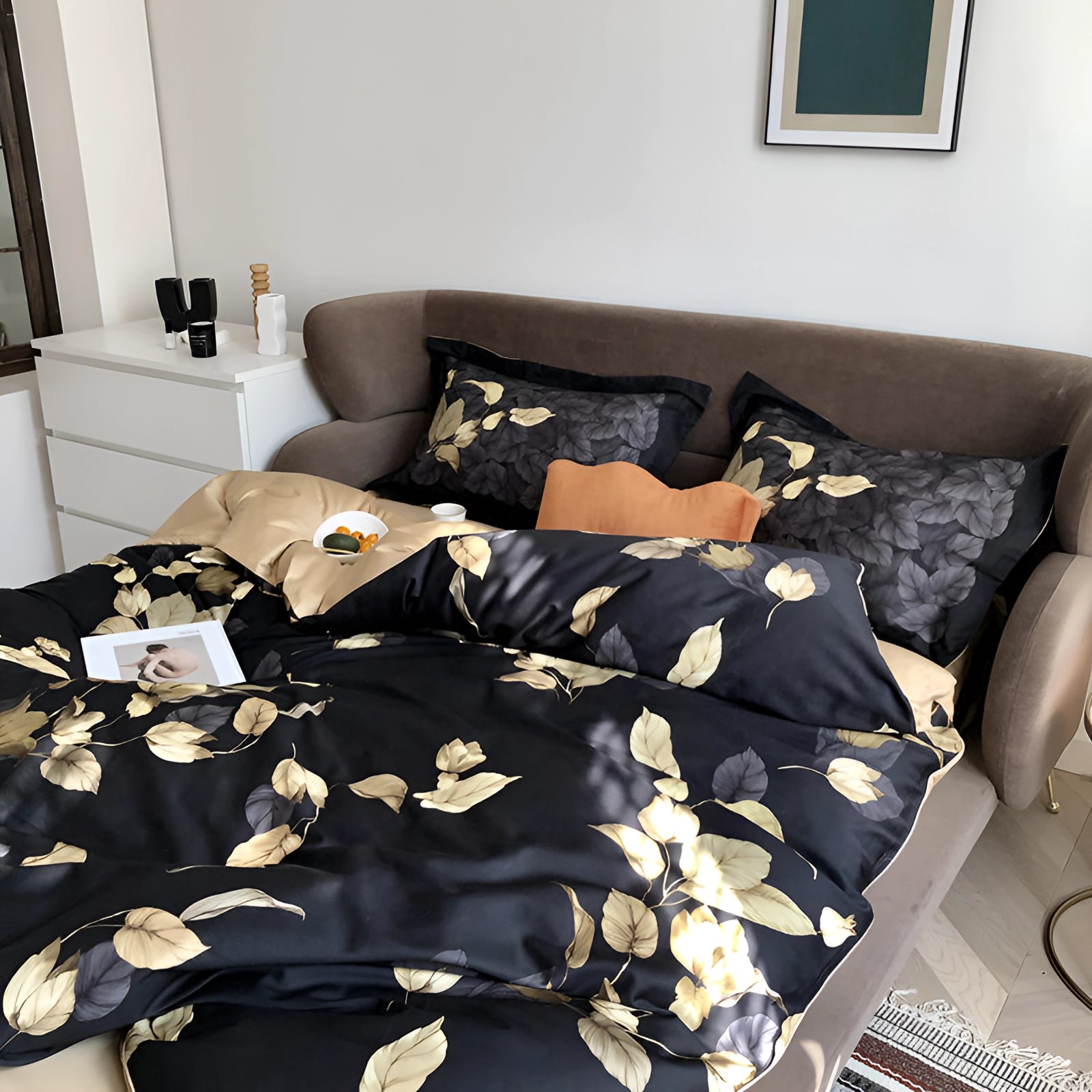 Luxury black gold floral duvet cover displayed in a cozy living room setting with a couch, decorative pillows, and wooden flooring, emphasizing comfort and interior design.