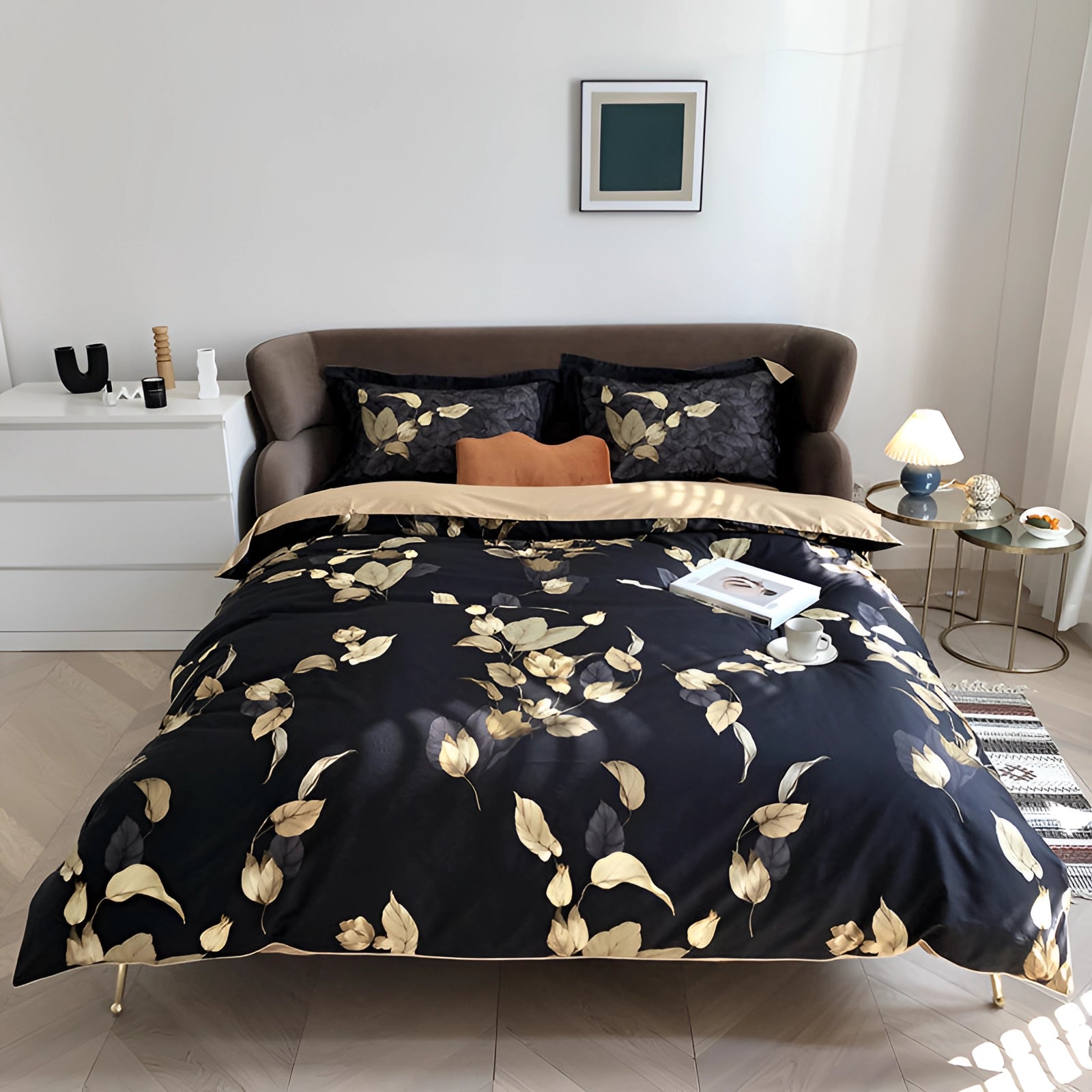 Luxury black and gold floral duvet cover on a California King bed, styled in an elegant botanical theme with accompanying furniture and interior design elements, featuring a wooden bed frame and grey flooring in the bedroom setting.