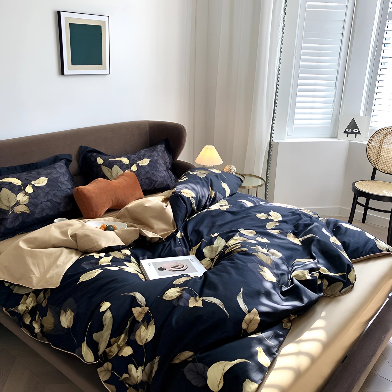 Luxury black gold floral duvet cover on a bed with wooden bed frame, set in an elegantly designed interior space with a focus on botanical themes.