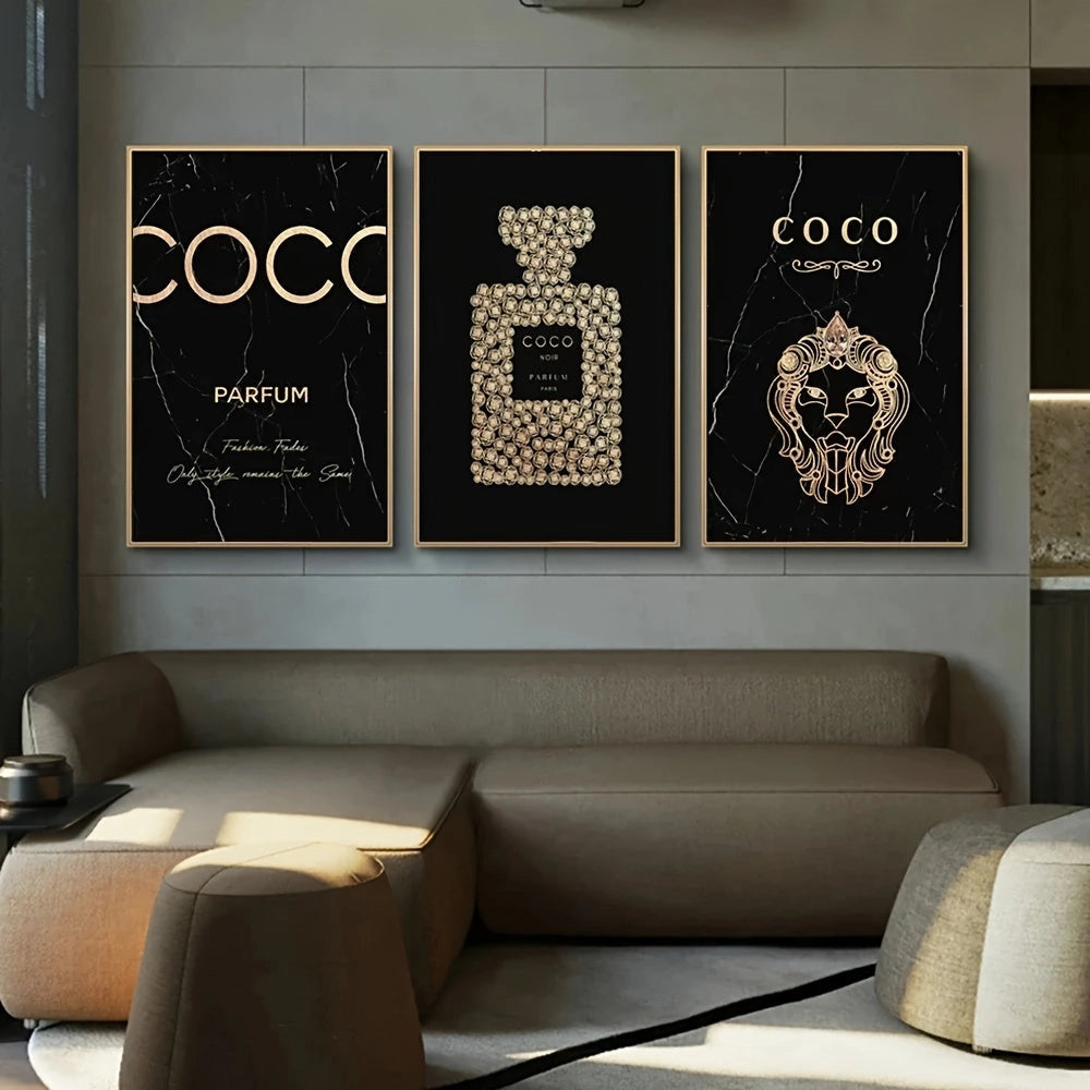 Luxury black and gold perfume-themed canvas trio art piece, displayed above a stylish grey couch in a modern living room setting.