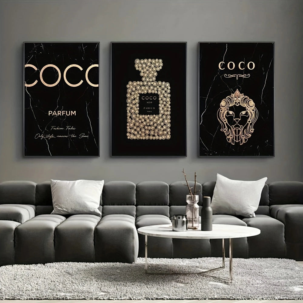 Elegant living room featuring a luxury black and gold perfume canvas trio artwork, displayed above a modern grey couch.
