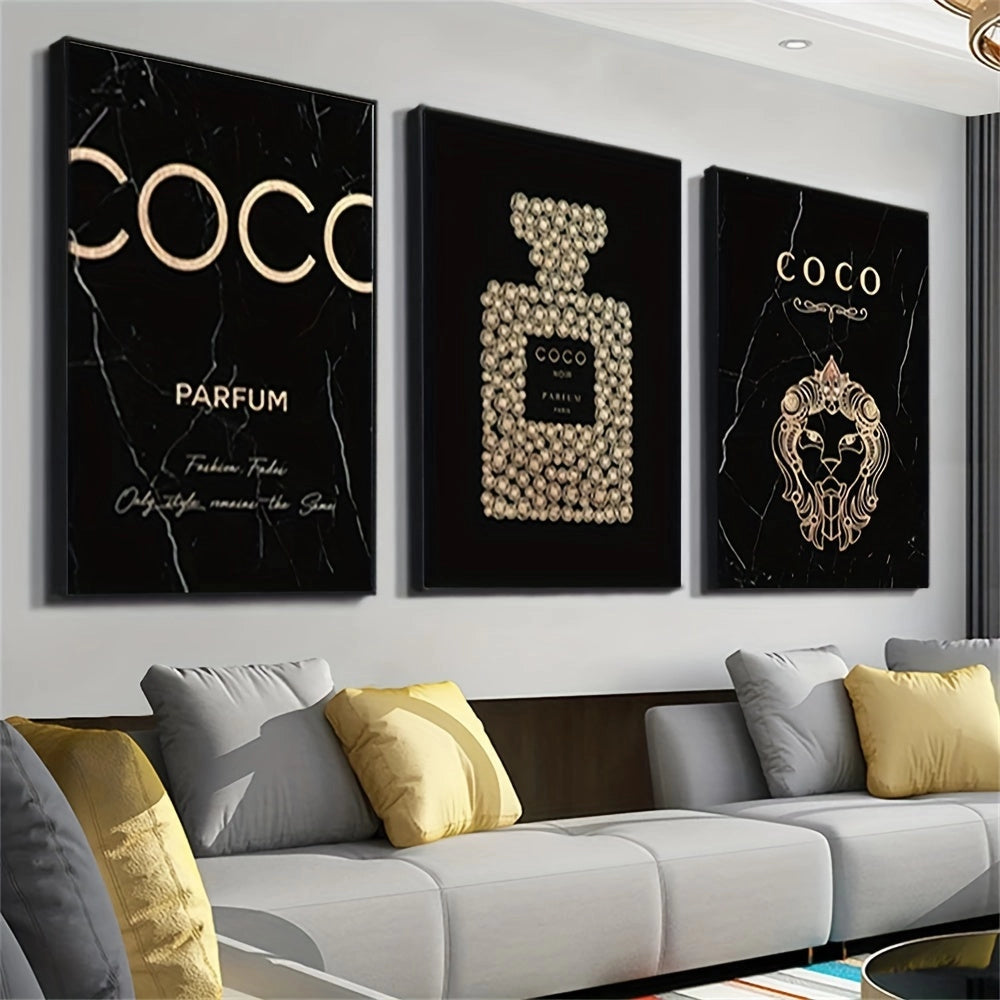 Luxurious black and gold perfume-themed canvas art trio displayed above a modern white couch in an elegantly designed living room.