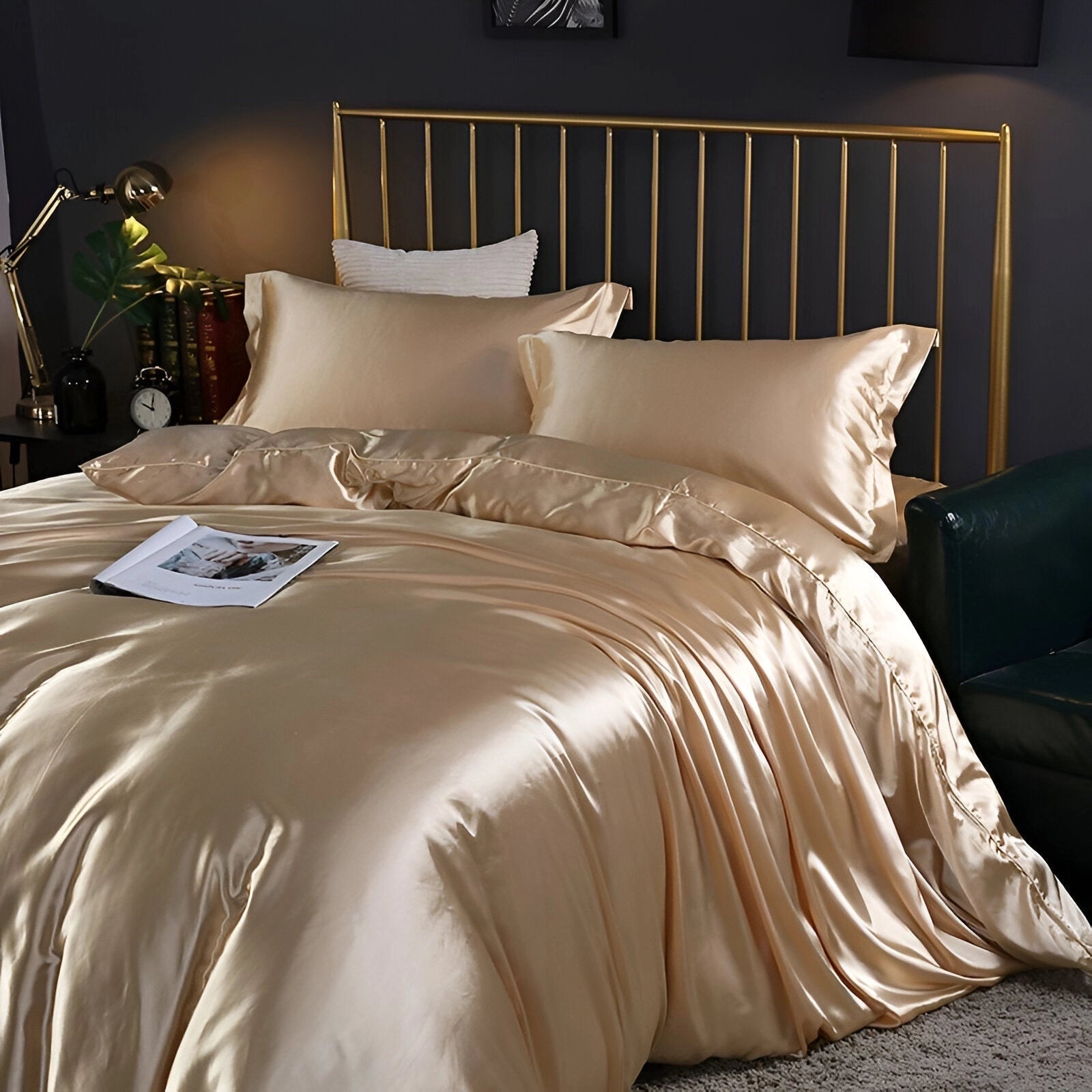 Luxury black leather bed with gold and marble accents in a spacious, elegantly designed bedroom interior; the bed features a sleek black leather frame with a gold finish, accompanied by matching pillowcases, and complemented by stylish lighting and flooring elements.