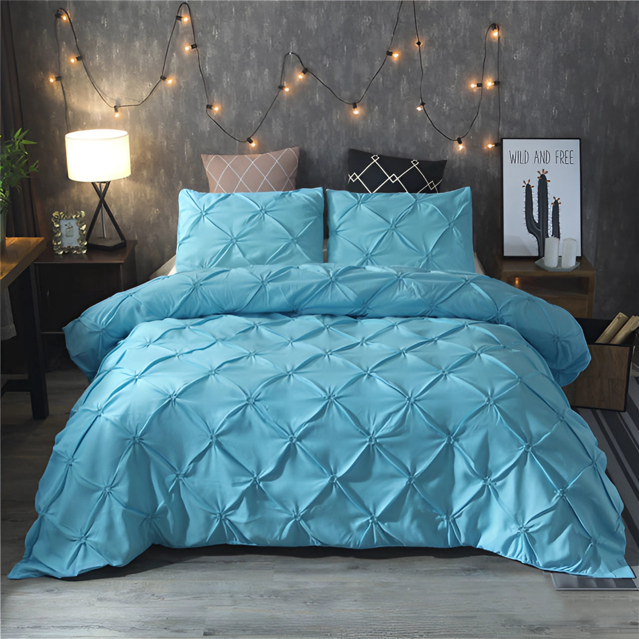 Luxury black pinch pleat comforter in a modern geometric design, displayed in a bedroom setting with a blue color tone, measuring 230x260cm. The comforter is laid on a bed alongside matching pillows, creating a cozy and stylish decor.