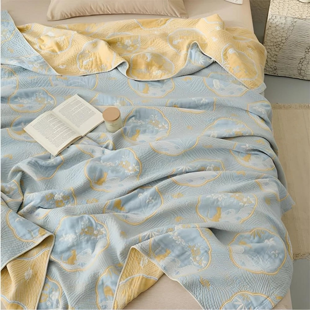 Luxury blue bedding set featuring an ornate gold floral pattern, showcasing electric blue and beige hues with a sophisticated textile design, displayed as a duvet linen.
