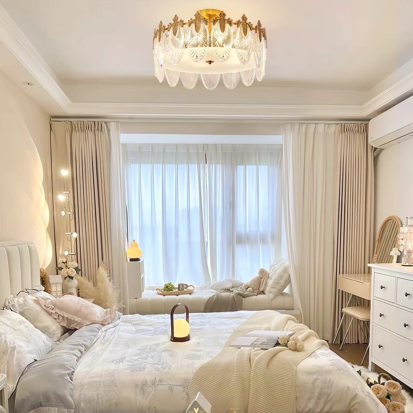 Luxury crystal chandelier with gold leaf accents, vintage ceiling light fixture in an elegantly decorated interior space.