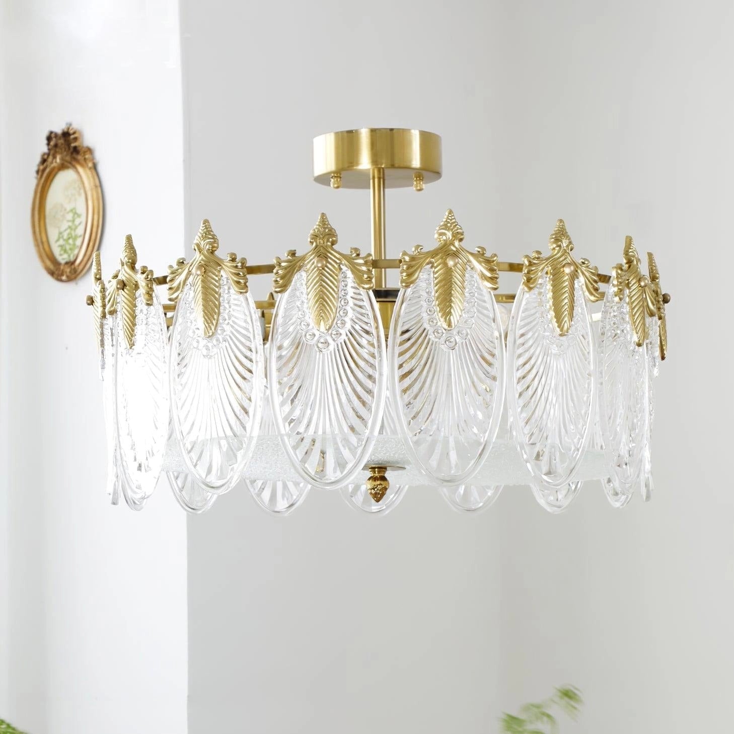 Luxury crystal chandelier with gold leaf vintage design and intricate detailing, hanging from ceiling.