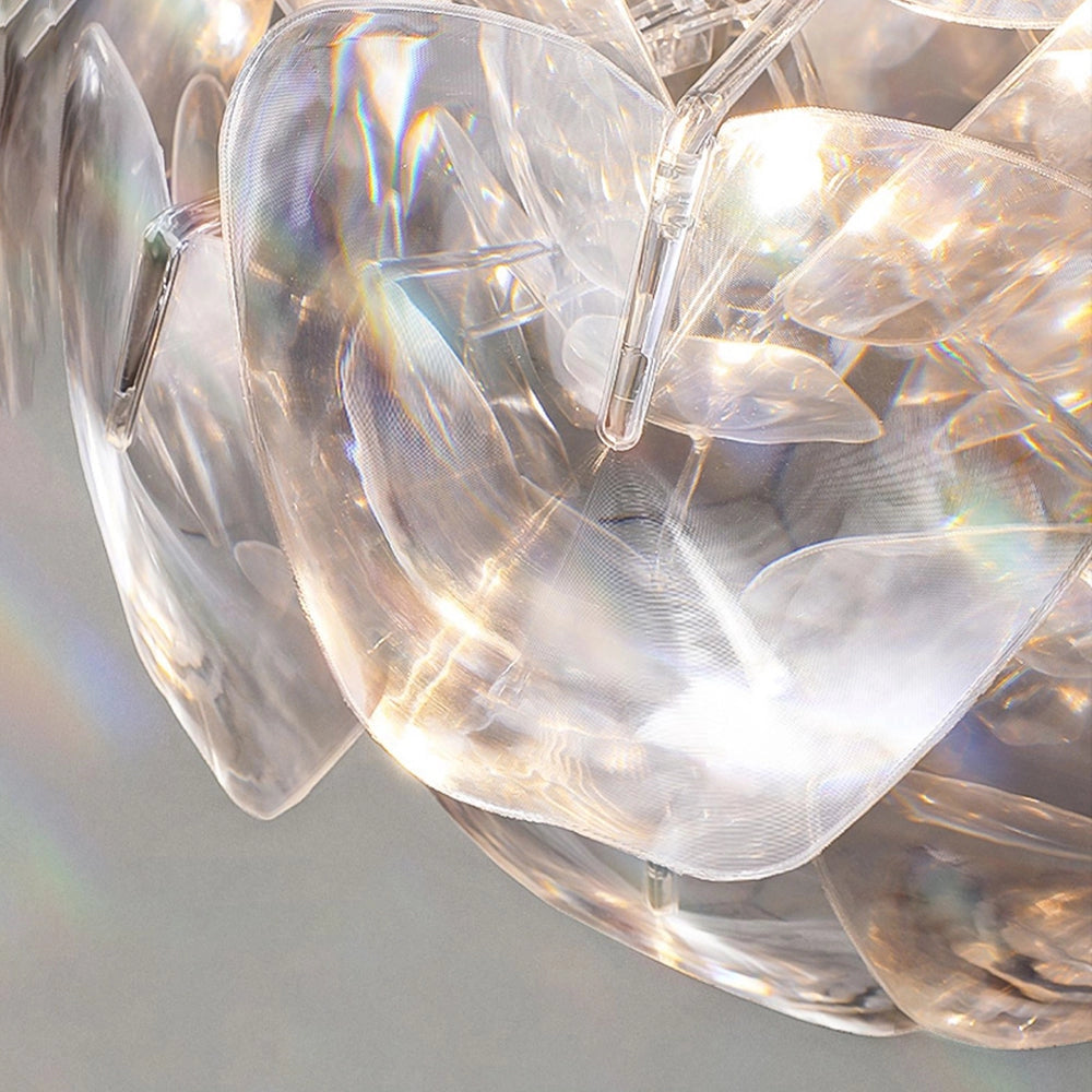 Luxury crystal pendant light with a modern design featuring a transparent glass chandelier. The elegant fixture showcases a circular pattern that enhances its artistic appeal.
