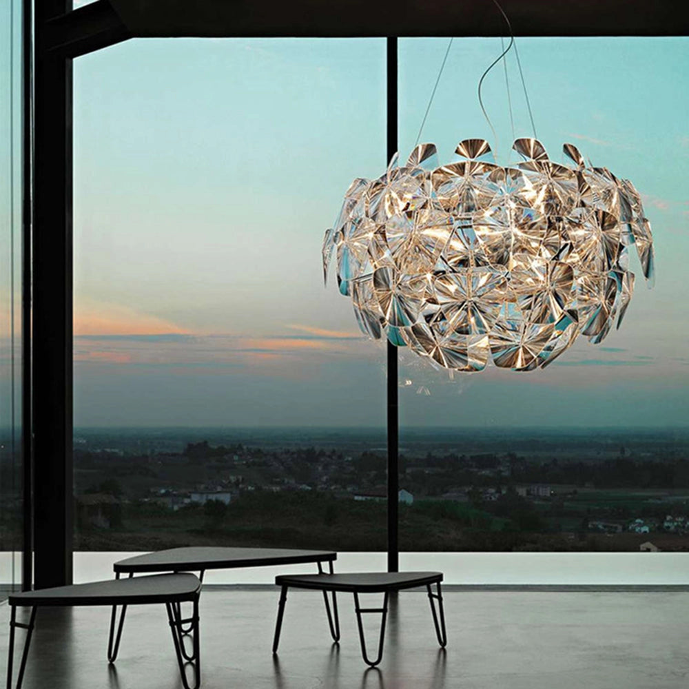Luxury crystal pendant light with modern glass chandelier design, featuring intricate crystal detailing and a 27.5" length, beautifully catching and reflecting light against a serene background.