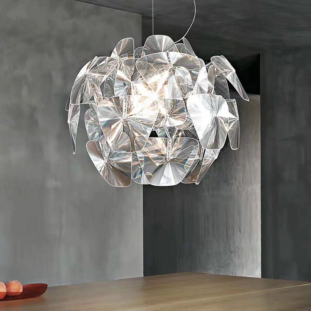 Luxury crystal pendant light featuring a modern glass chandelier design, mounted as a ceiling fixture. The light casts soft tints and shades, highlighting the artful combination of glass and wood elements in a circular arrangement.