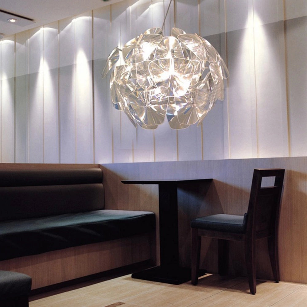 Luxury crystal pendant light in a modern design, featuring a 23.6-inch glass chandelier, elegantly illuminating a stylish interior space with contemporary decor elements.